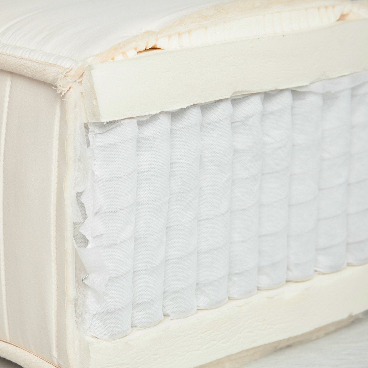Cutaway of the Altro mattress showing individually wrapped coils under a natural latex layer