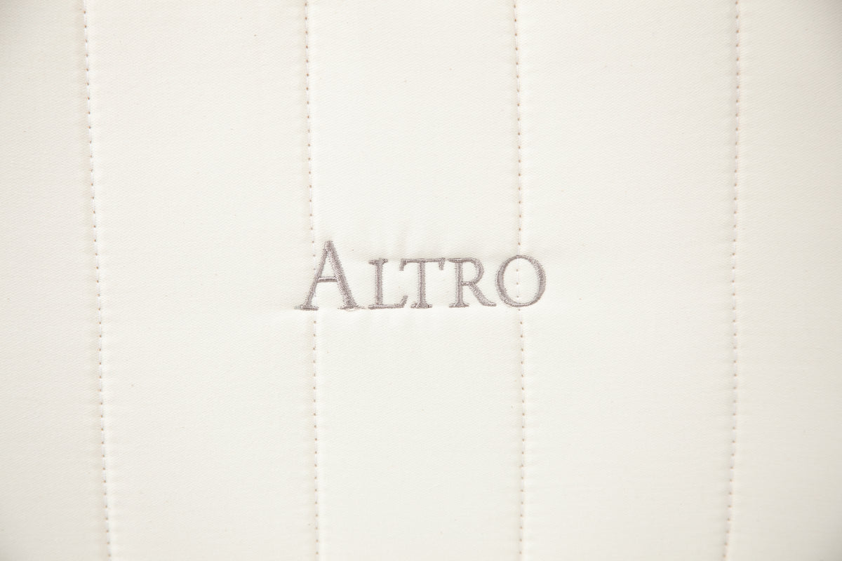 Close-up of ALTRO embroidered on the quilted side of the mattress