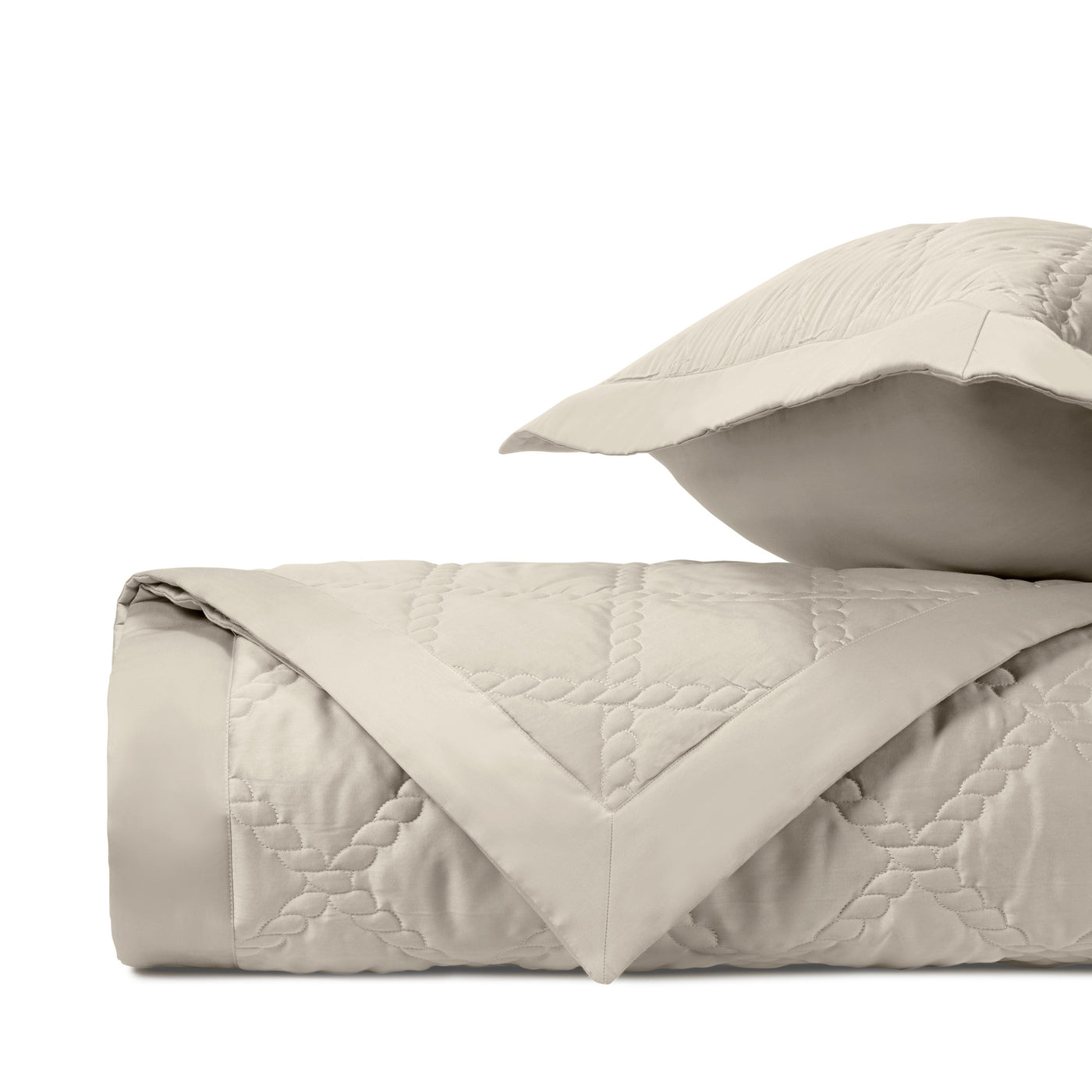 Close-up of Home Treasures Liberty quilted texture in ivory, showing diamond stitching pattern.