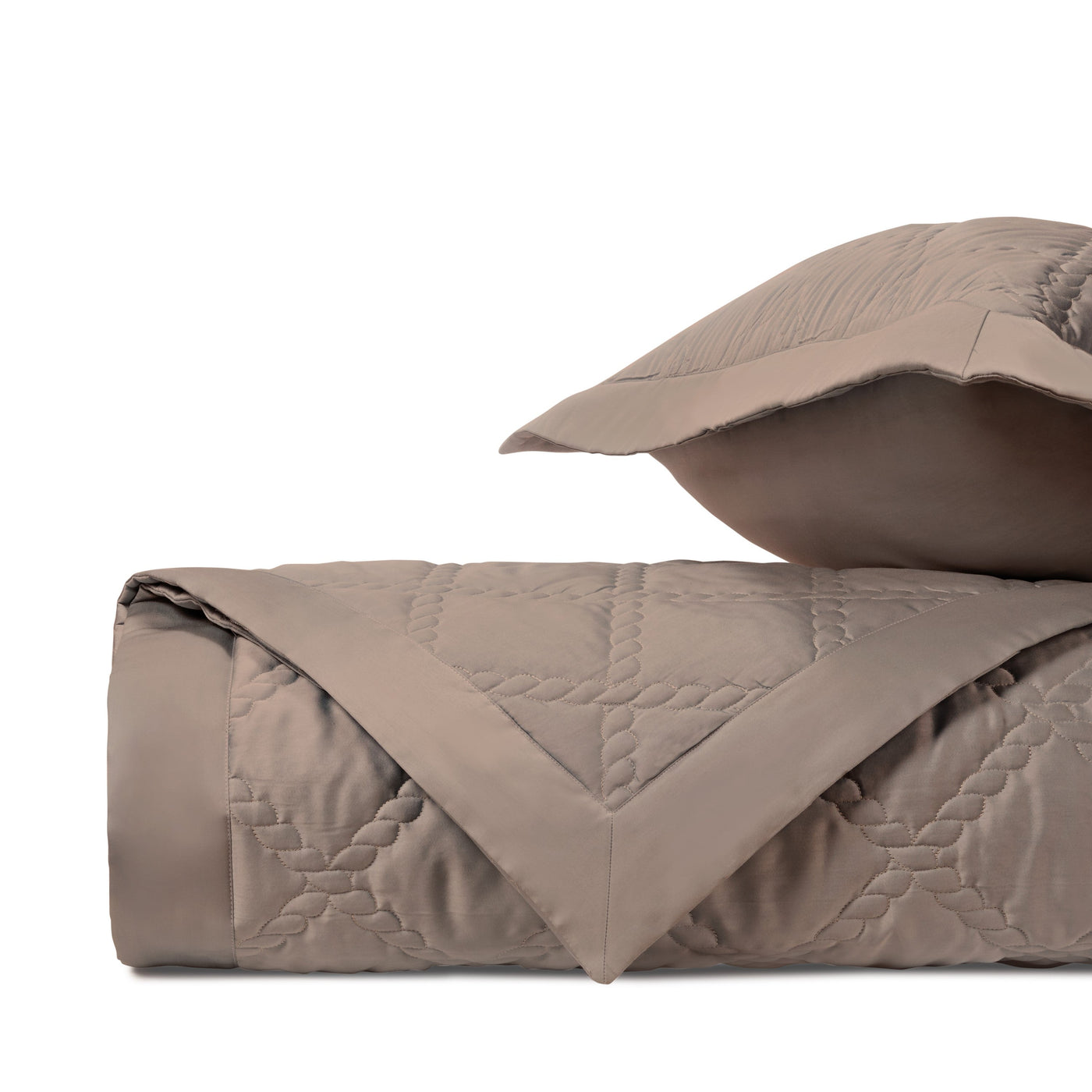 Close-up of Home Treasures Liberty quilted coverlet in taupe with geometric diamond stitching.