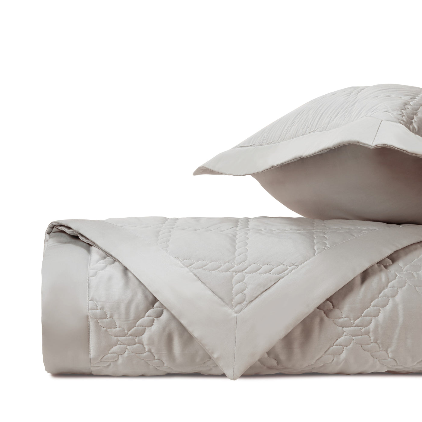 Close-up of Home Treasures Liberty quilted texture in silver-grey with geometric stitching.