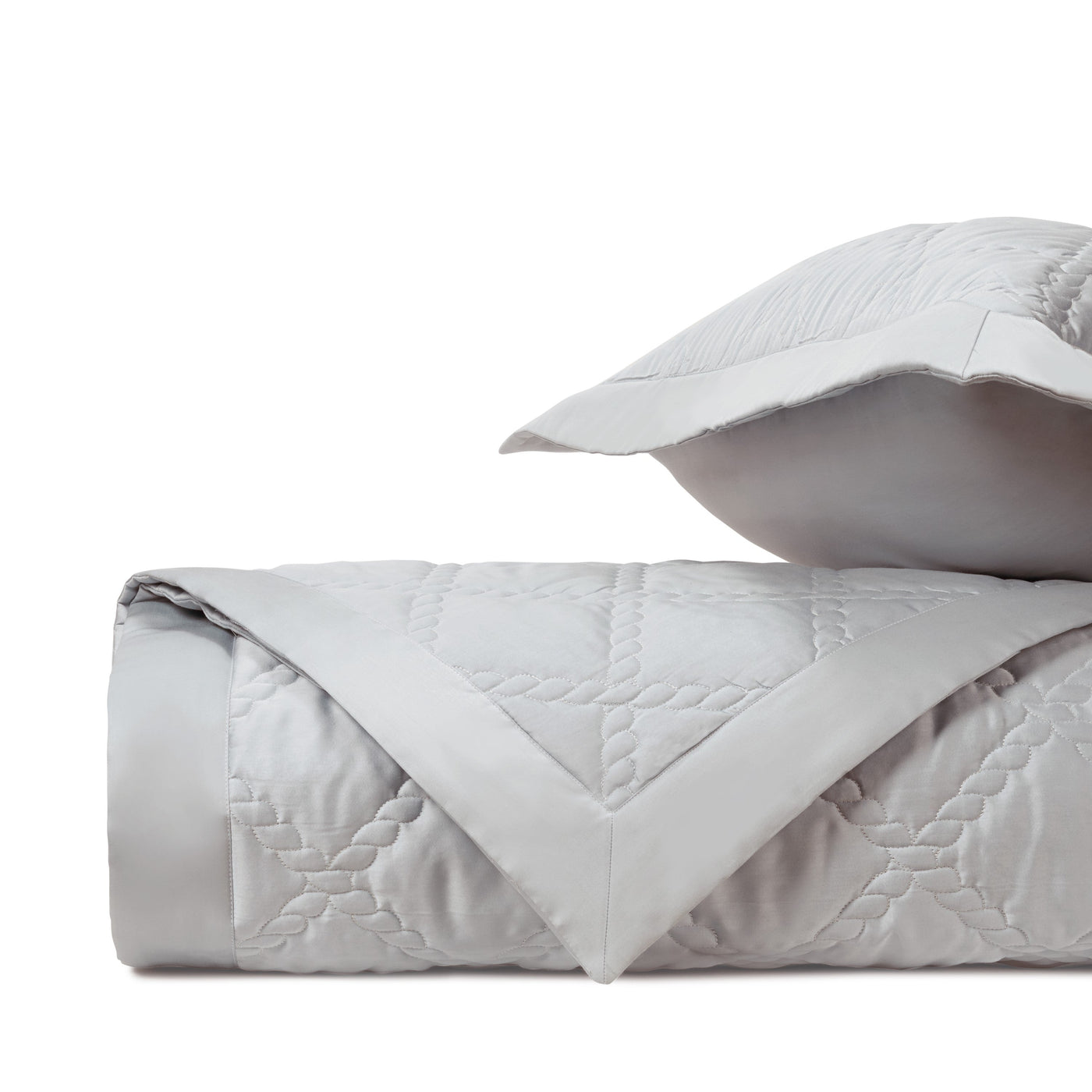 Close-up of Home Treasures Liberty quilted texture in silver-grey with geometric stitching.
