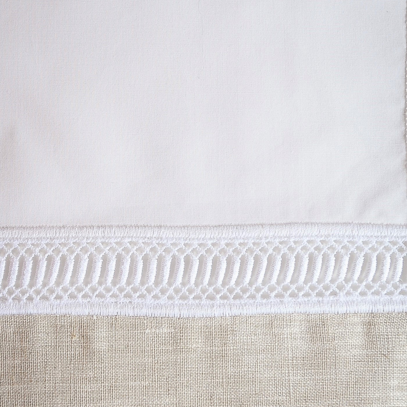 Close-up of white hemstitch border detail on Home Treasures Linea pillow sham.