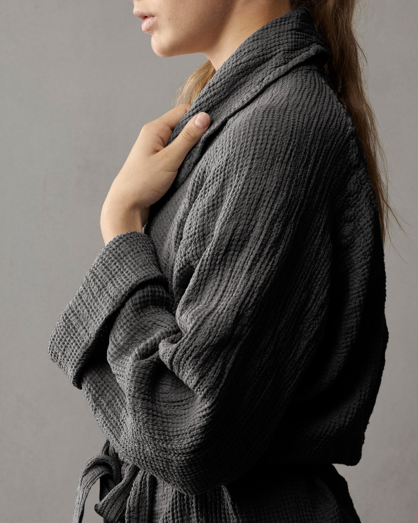 Close-up side view of Society Limonta Lipe New robe in charcoal, showing waffle texture and shawl collar.