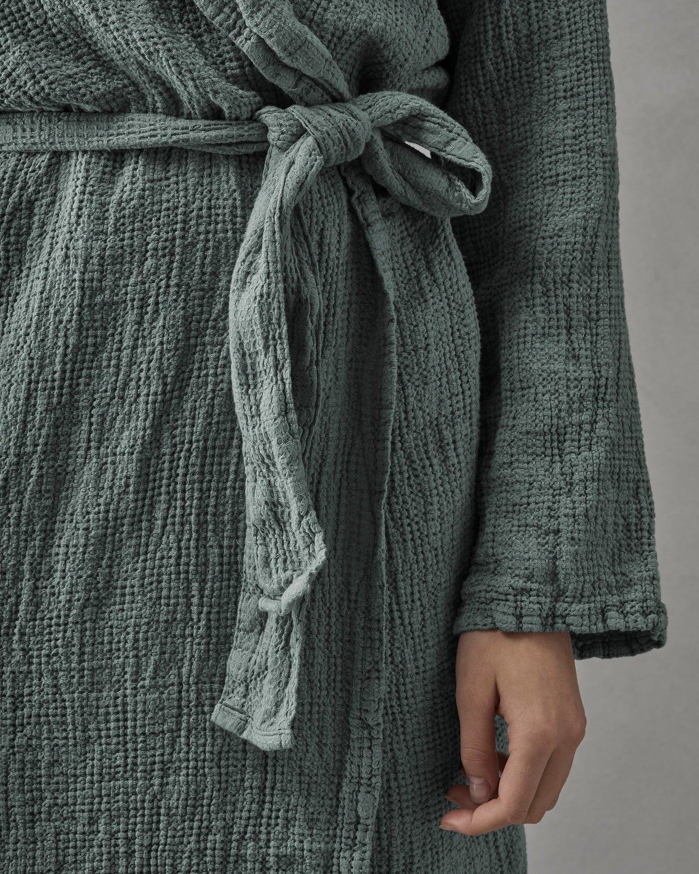Close-up of Society Limonta Lipe New robe belt tied at waist in sage cotton gauze.