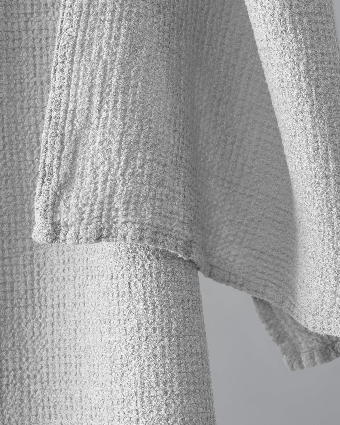 Close-up of Society Limonta Lipe New waffle-weave texture and hemmed edge in ivory.