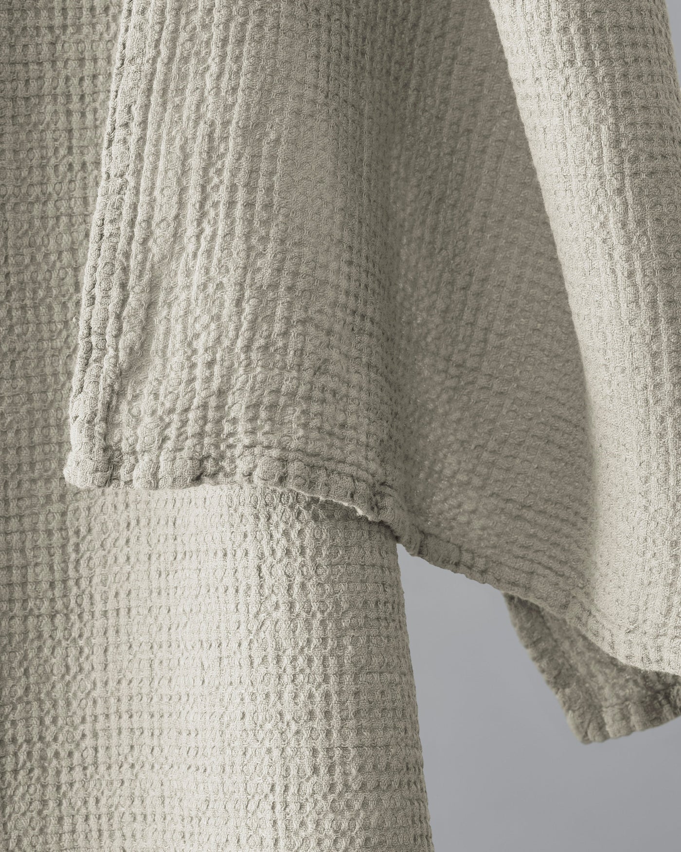 Close-up of Society Limonta Lipe New waffle-weave texture and stitched hem detail in natural.
