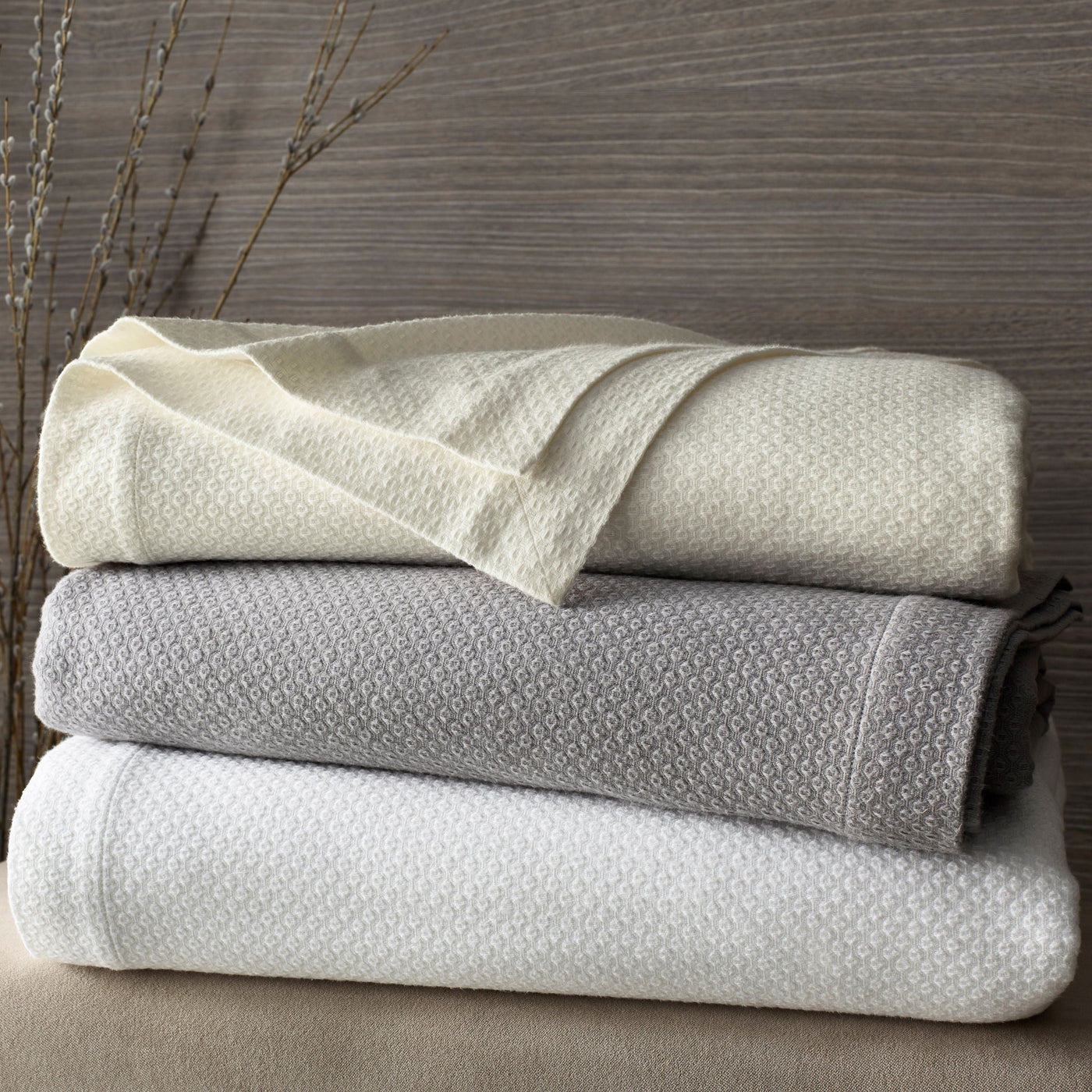 Home Treasures Lisboa folded yardage stack in ivory, dove grey, and white diamond weave cotton.
