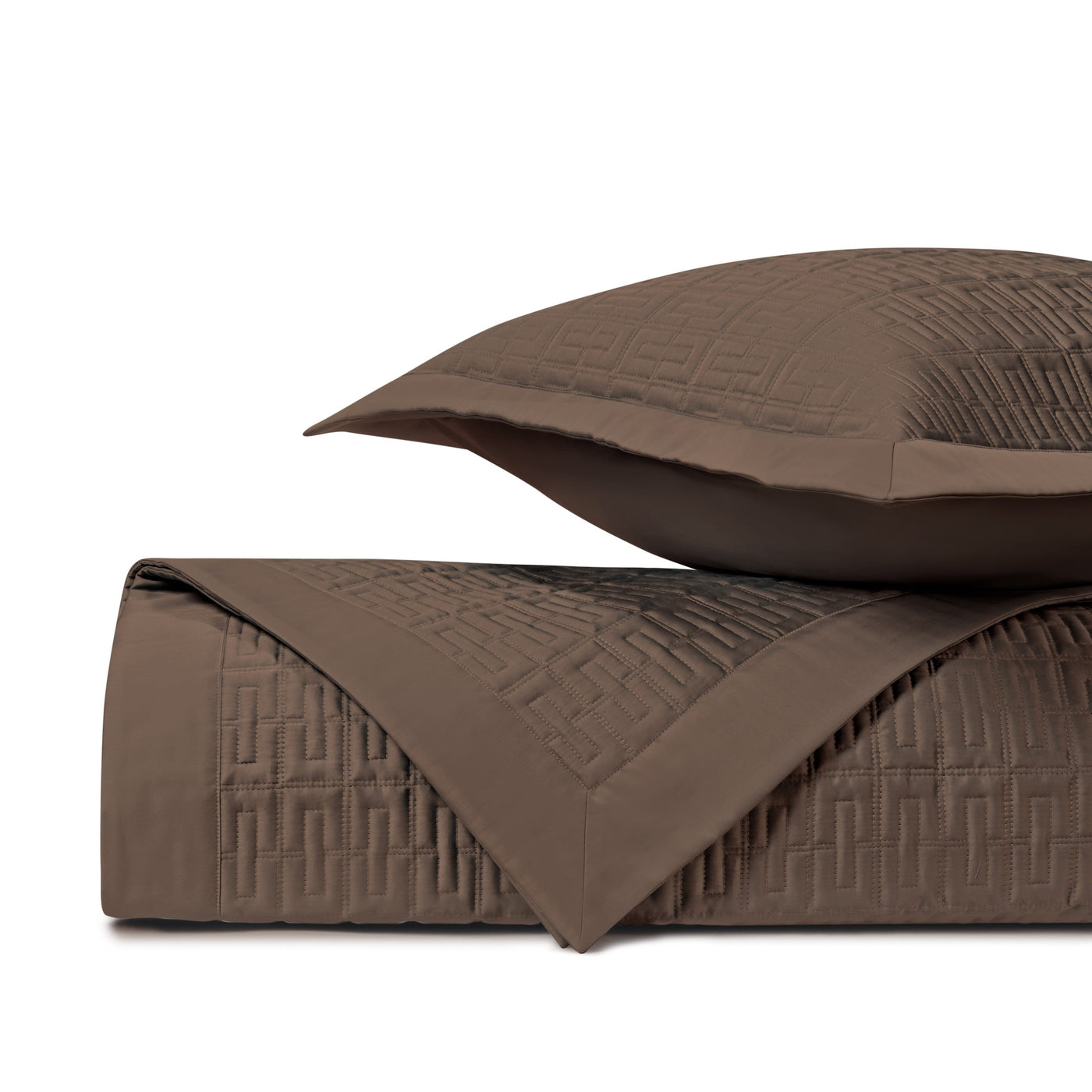 Close-up of Londres quilted coverlet in mink, showing geometric grid stitching detail.