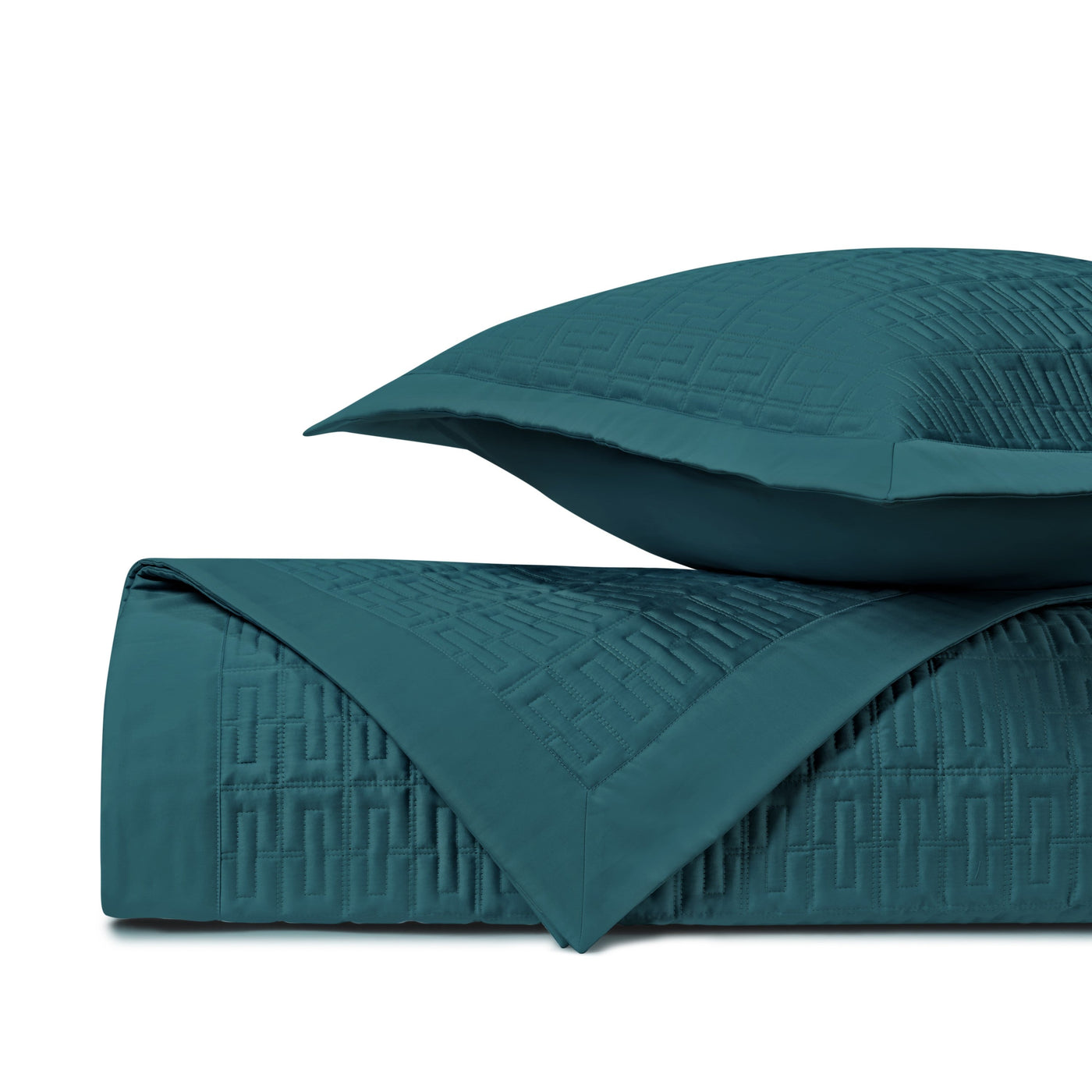Teal quilted texture detail on Londres coverlet and sham, geometric basket-weave stitching.