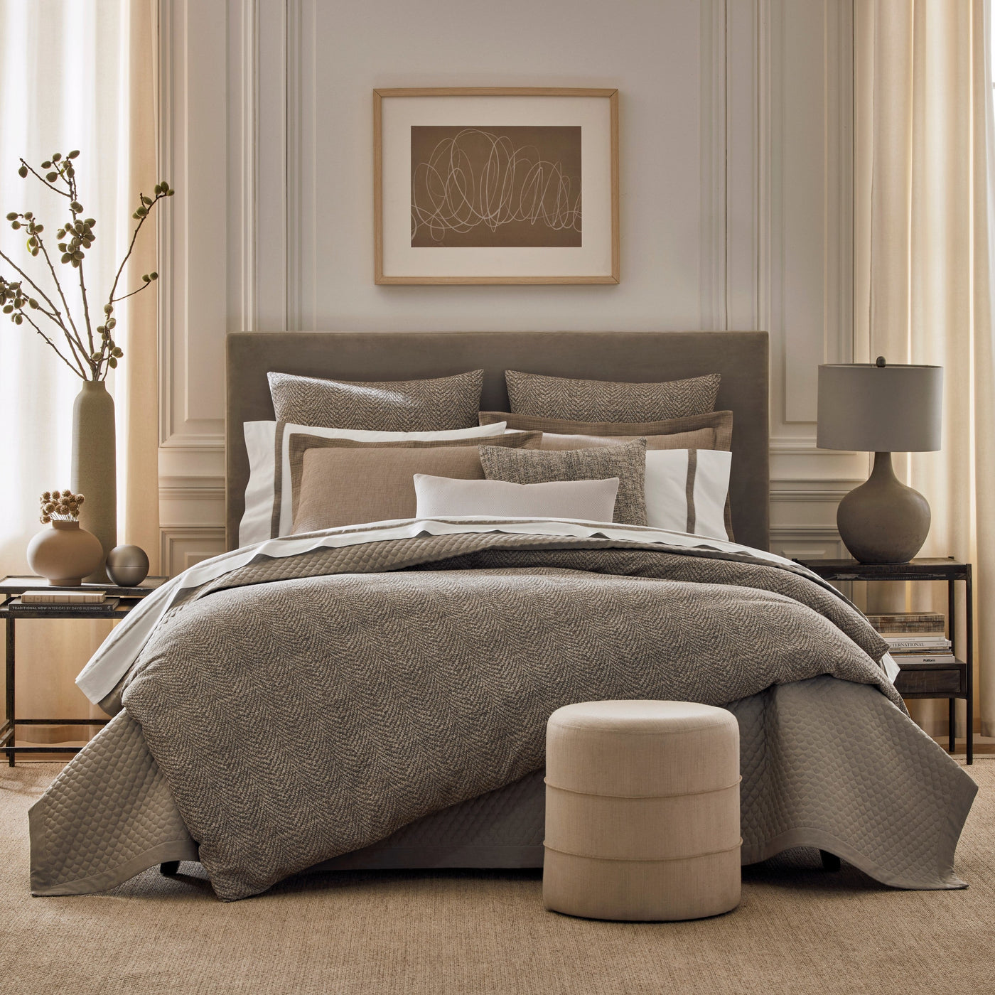 Mocha textured jacquard bedding styled on a bed with layered neutral pillows.