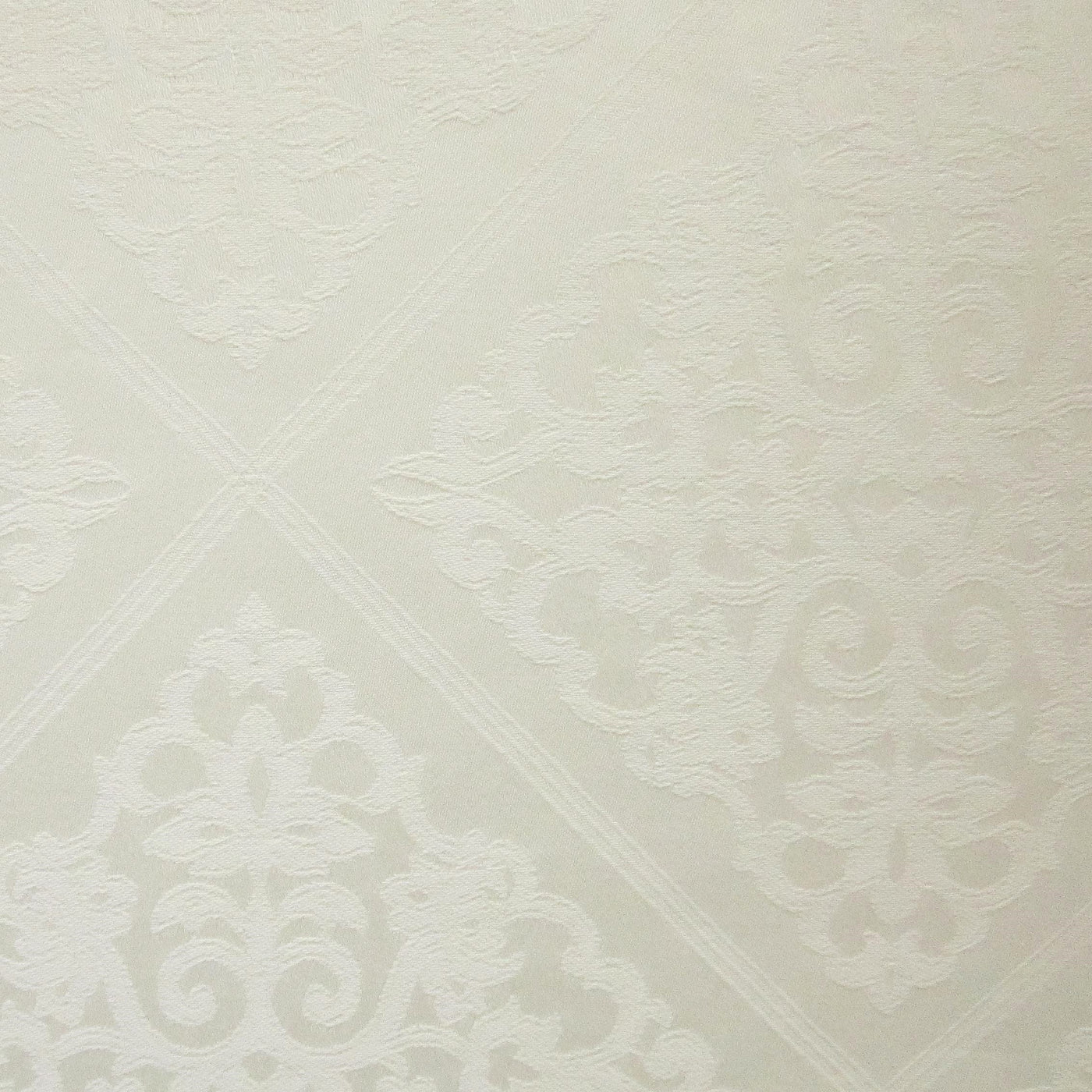 Close-up of ivory jacquard damask weave pattern on Home Treasures Luciana fabric.