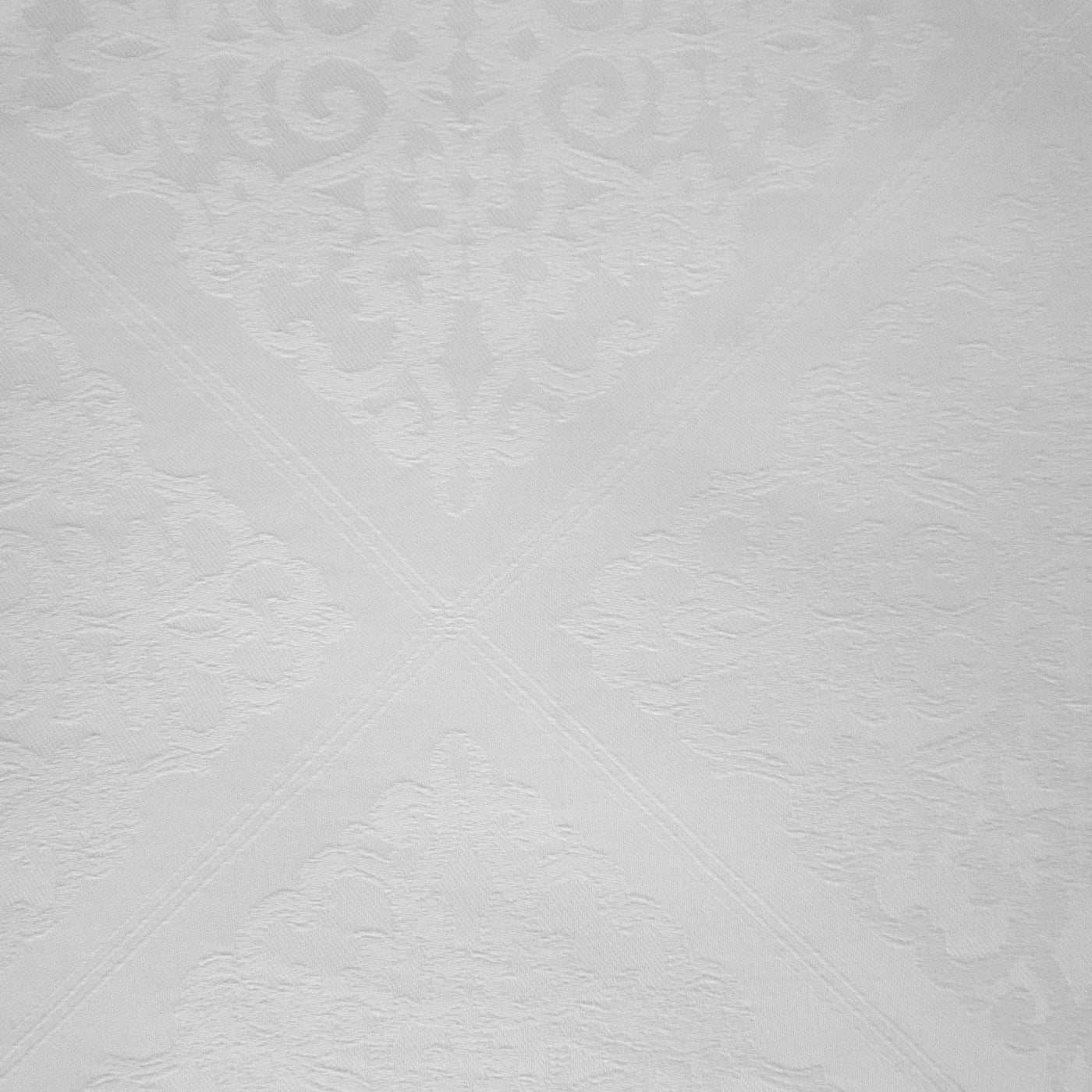 Close-up of Home Treasures Luciana ivory damask jacquard weave with mitered corner detail.