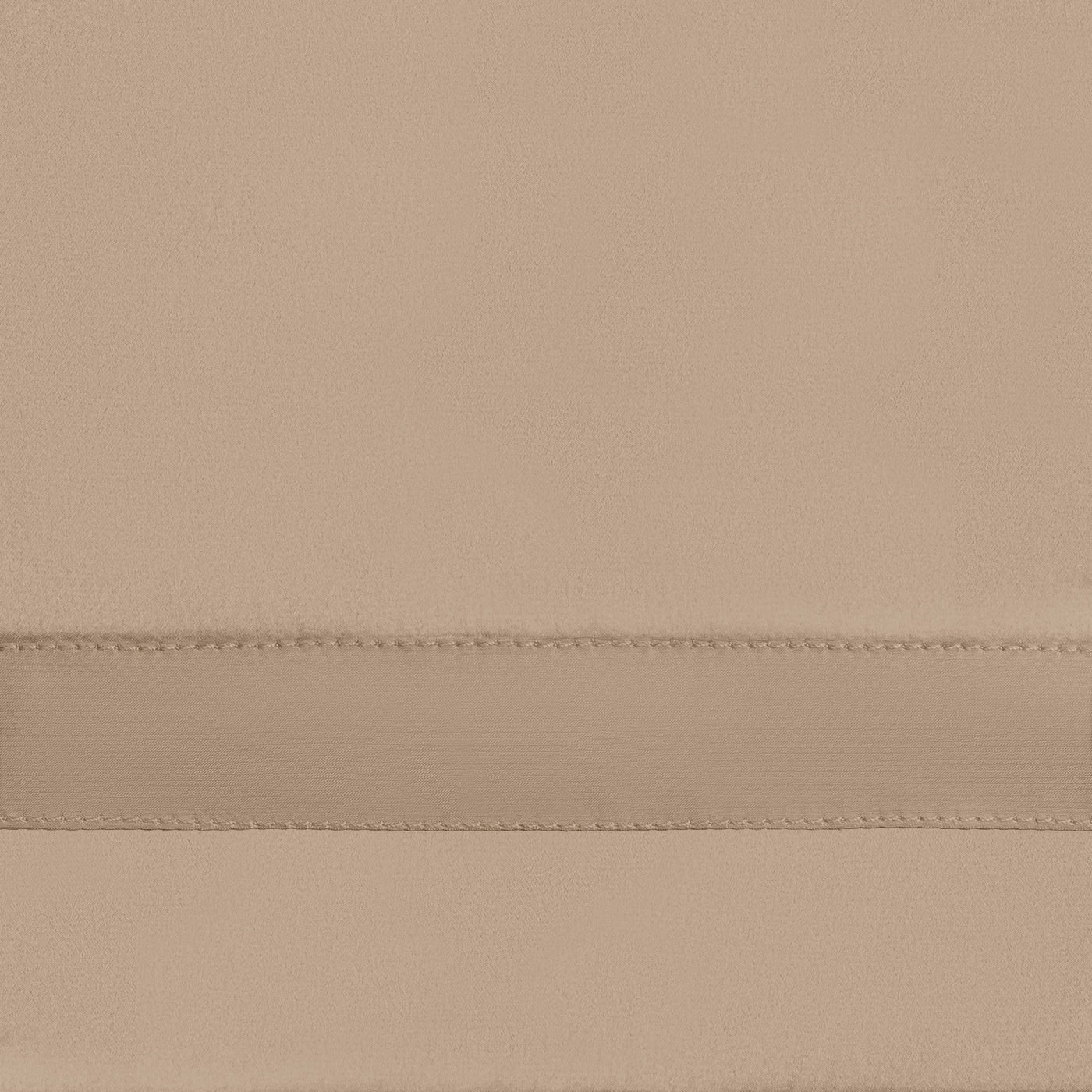 Close-up of a champagne satin fitted sheet showing a double-stitched horizontal seam detail.
