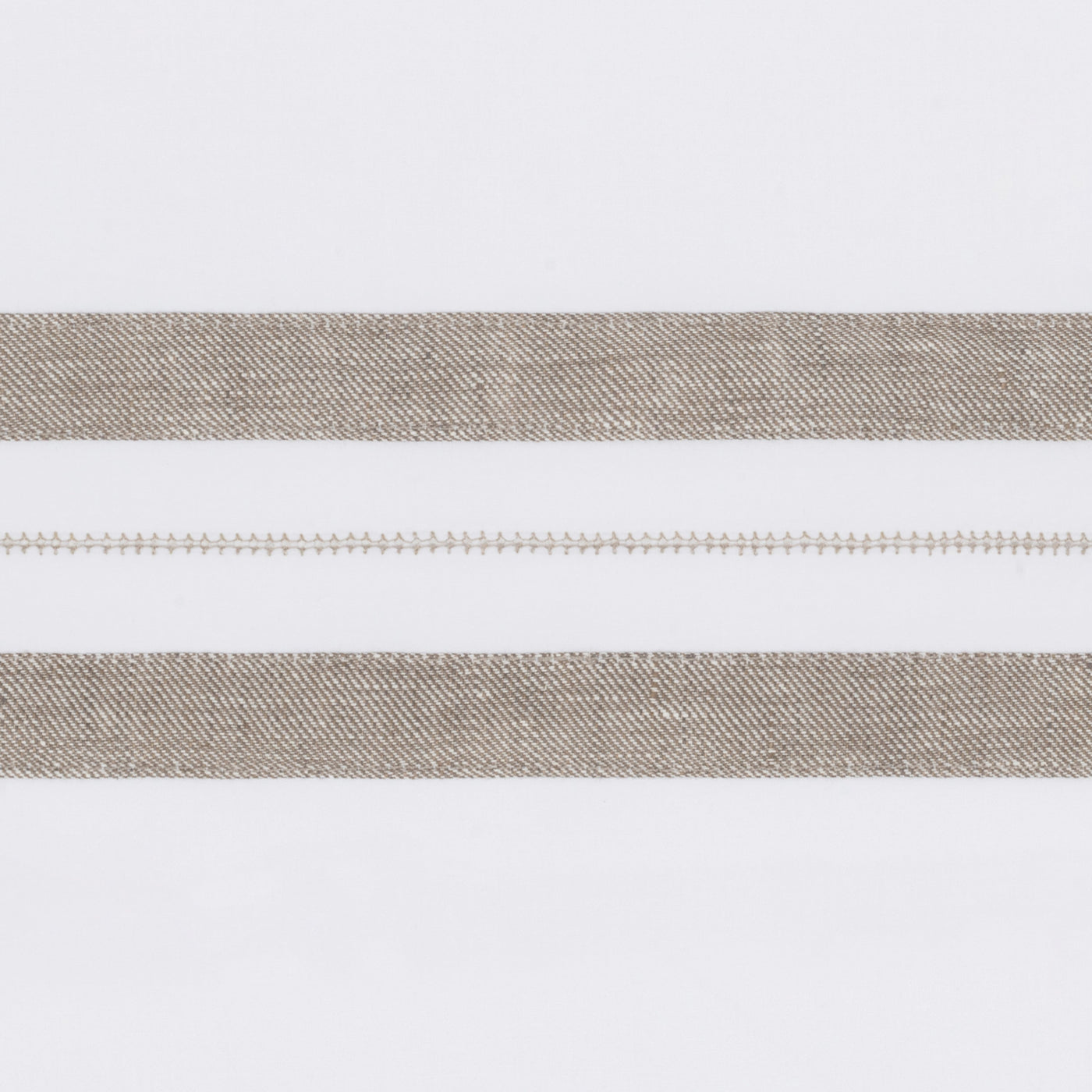 Close-up of taupe woven stripes with delicate hemstitch detail on white linen.