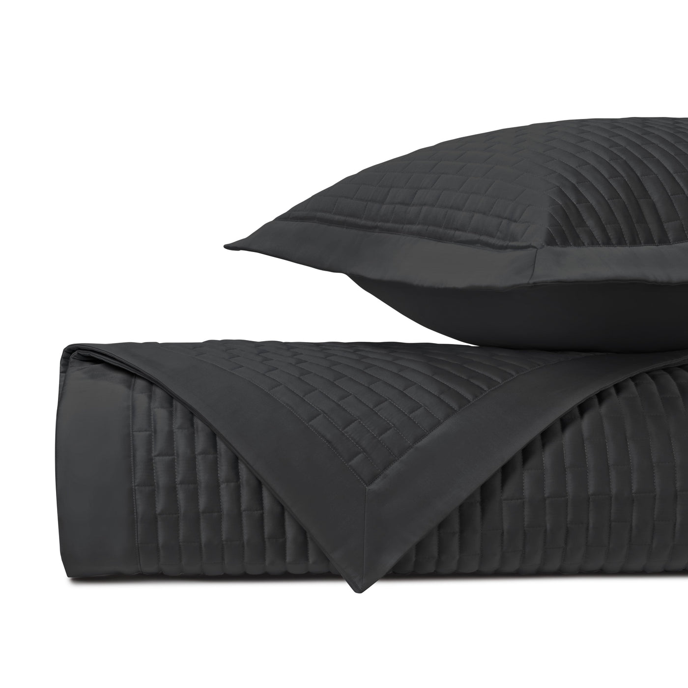 Close-up of black quilted basket-weave stitching on Mason coverlet and sham.