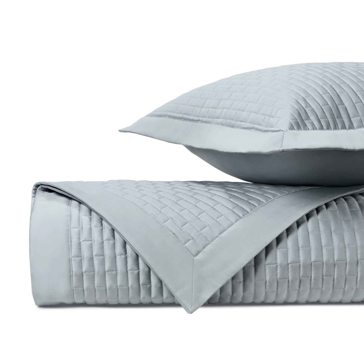 Close-up of Mason quilted coverlet and sham in silver, showing basket-weave stitch pattern.