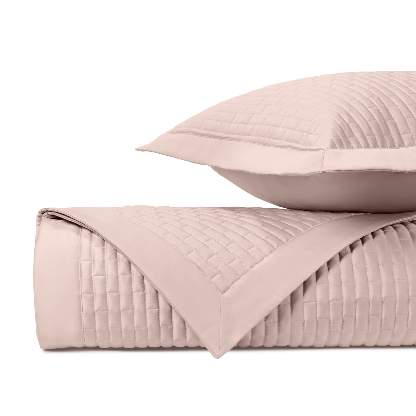 Close-up of Home Treasures Mason quilted texture in blush pink with grid stitching.