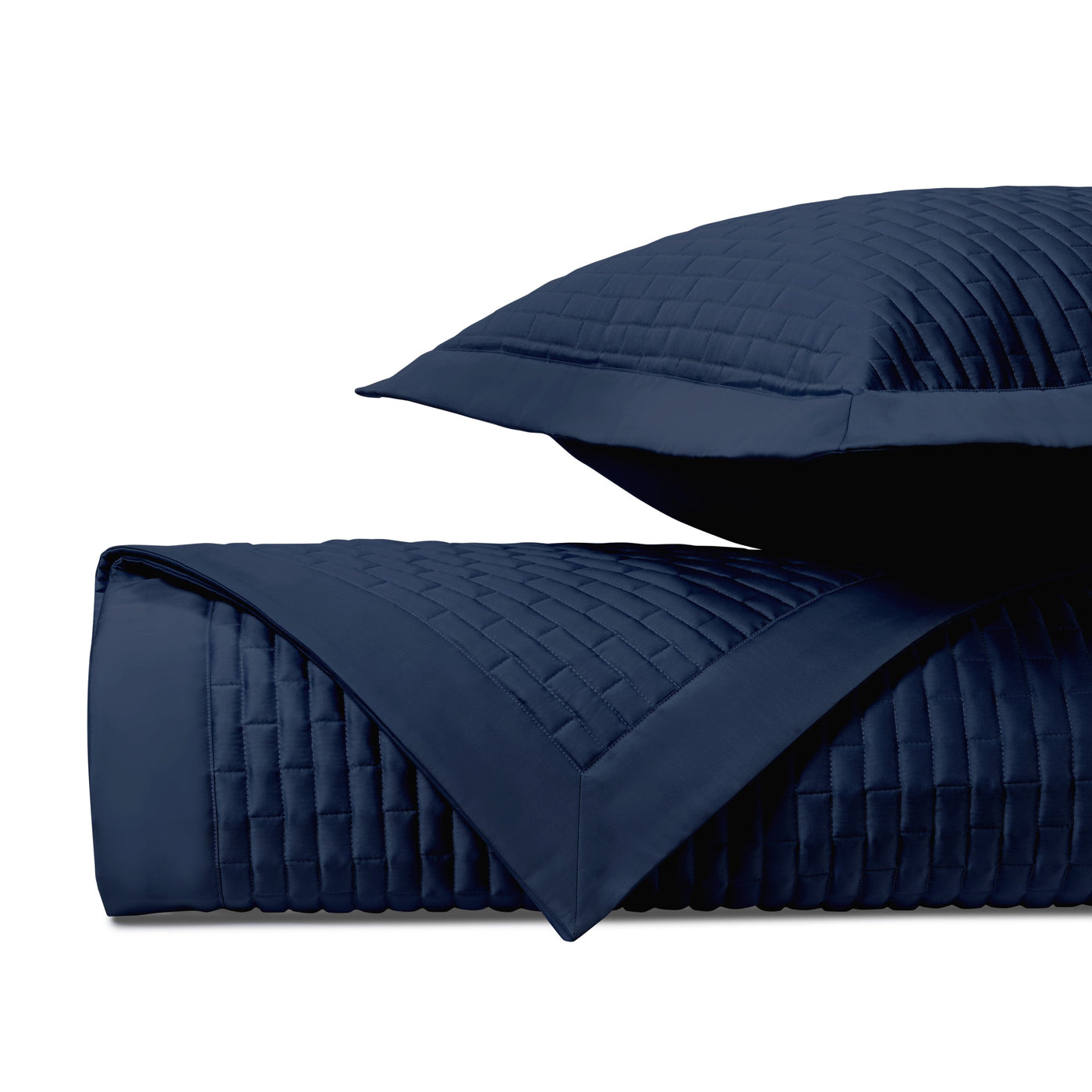 Close-up of Home Treasures Mason navy quilted texture with basket-weave stitching detail.