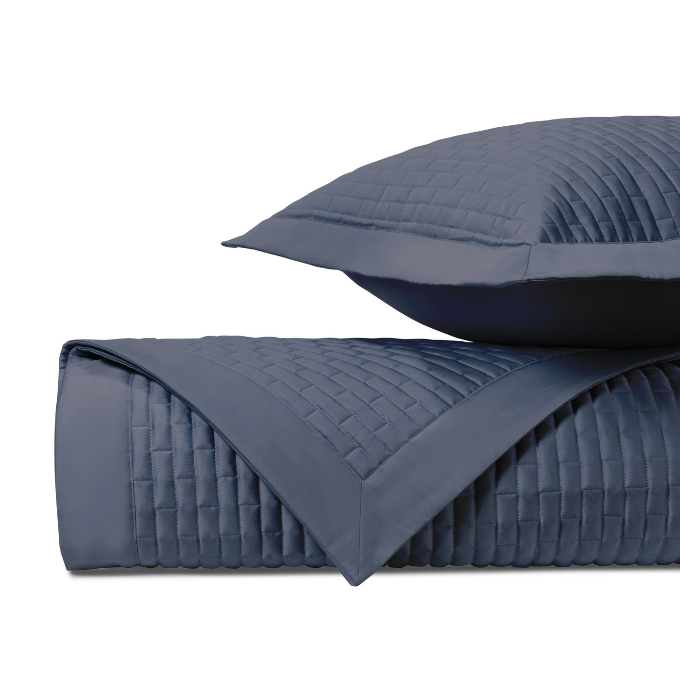 Close-up of navy blue quilted basketweave texture on Mason coverlet and sham.