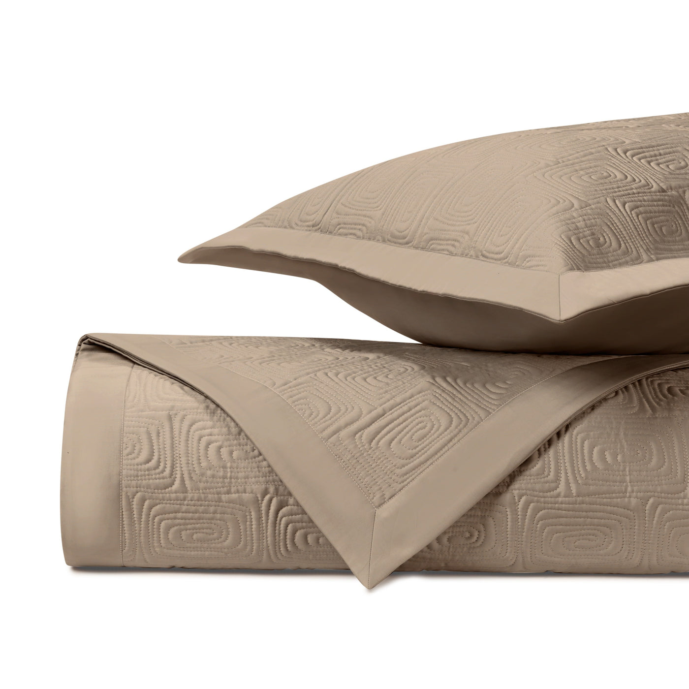Close-up of Home Treasures Maze quilted texture in taupe with geometric embossed pattern.