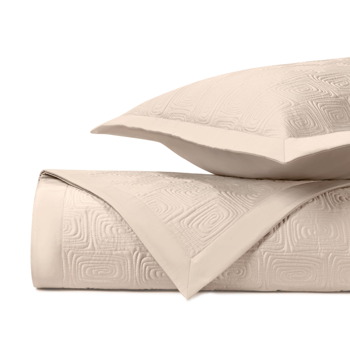 Close-up of Home Treasures Maze quilted texture in ivory with geometric relief pattern.