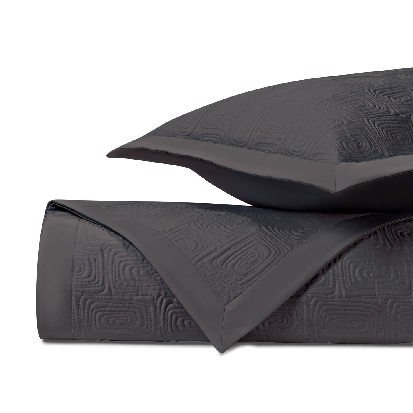Close-up of Home Treasures Maze quilted coverlet in charcoal with geometric relief pattern.