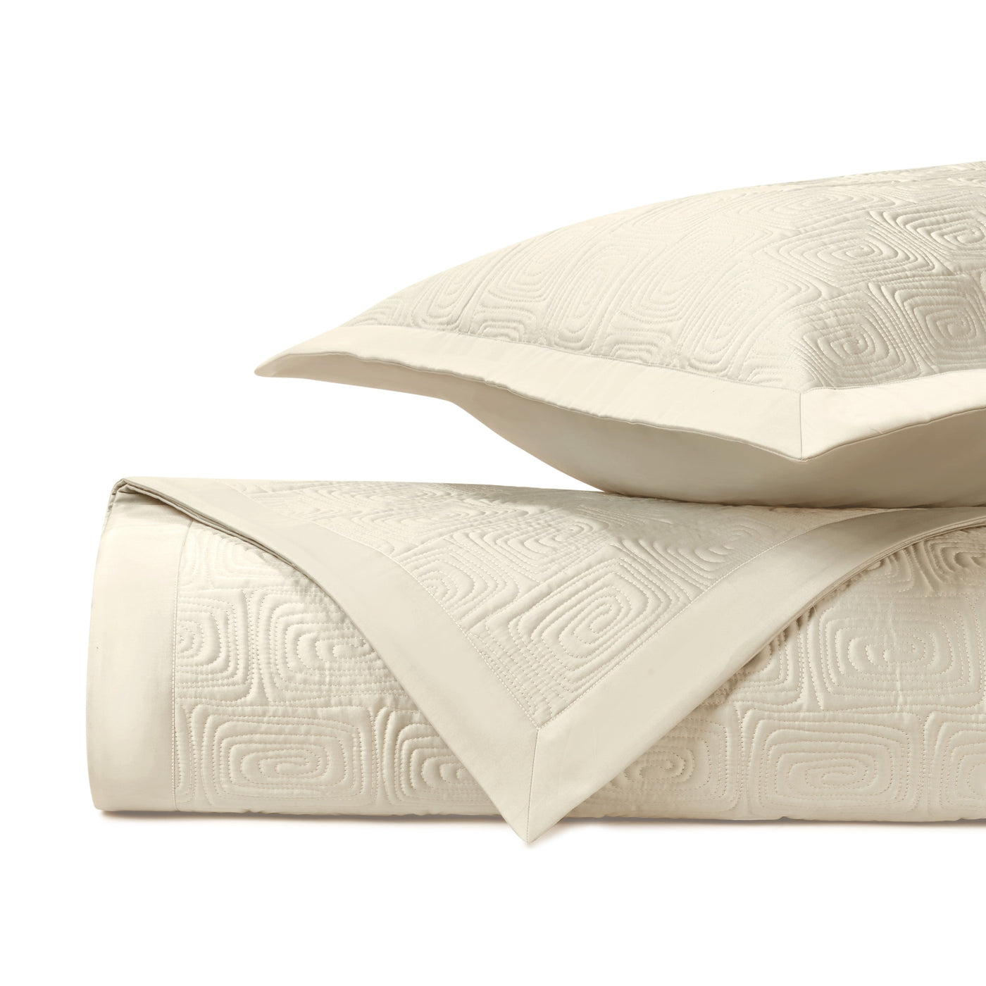 Home Treasures Maze ivory quilted coverlet and sham with geometric relief pattern.