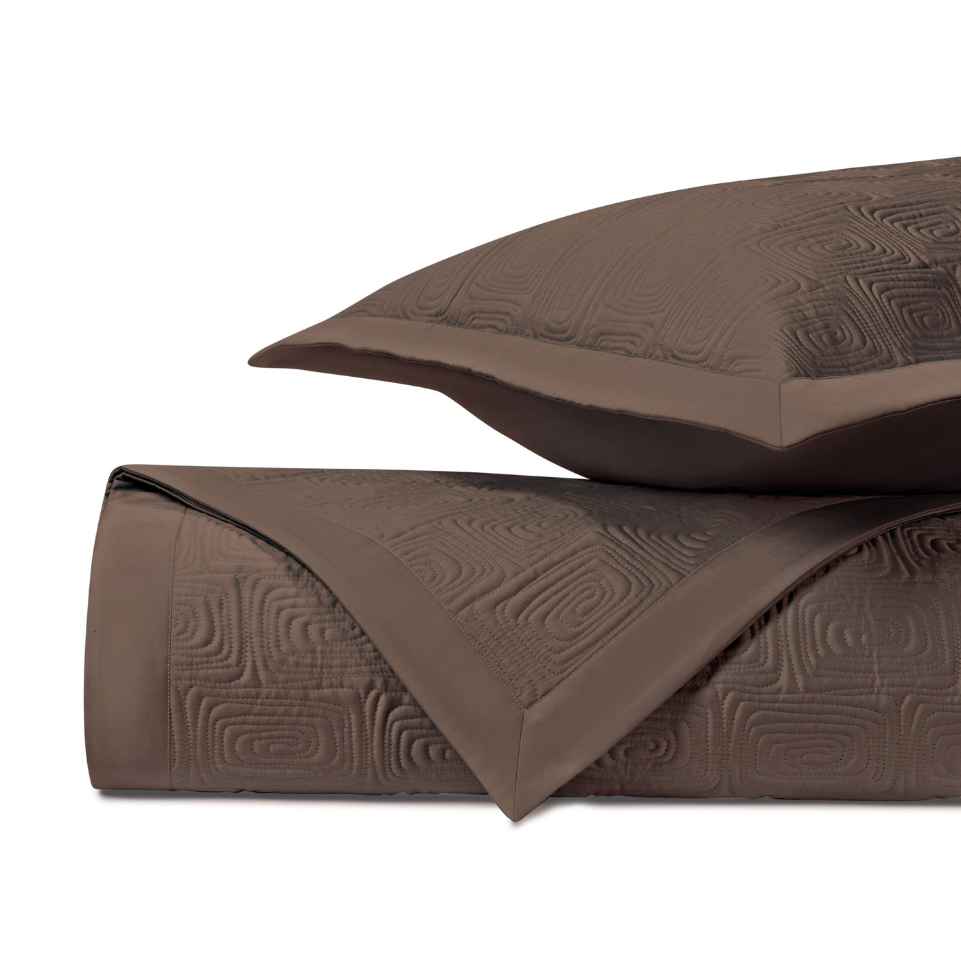 Close-up of Home Treasures Maze quilted texture in mocha with geometric relief pattern.