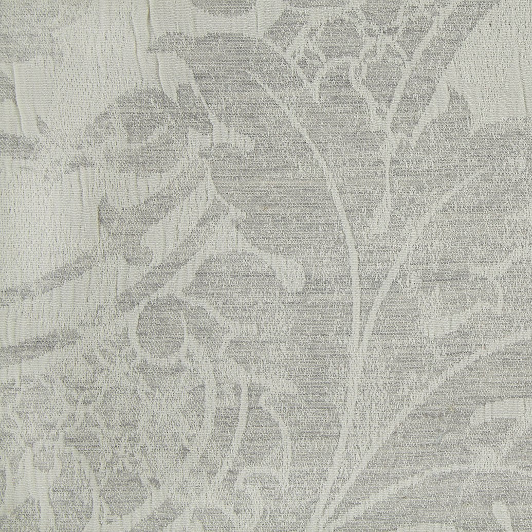 Close-up of ivory jacquard weave with tonal floral and leaf damask pattern.