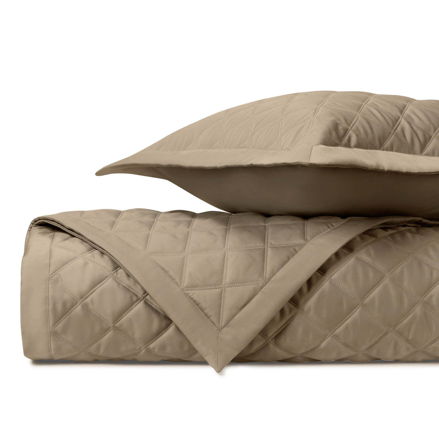 Driftwood quilted coverlet and sham set with diamond stitching pattern.