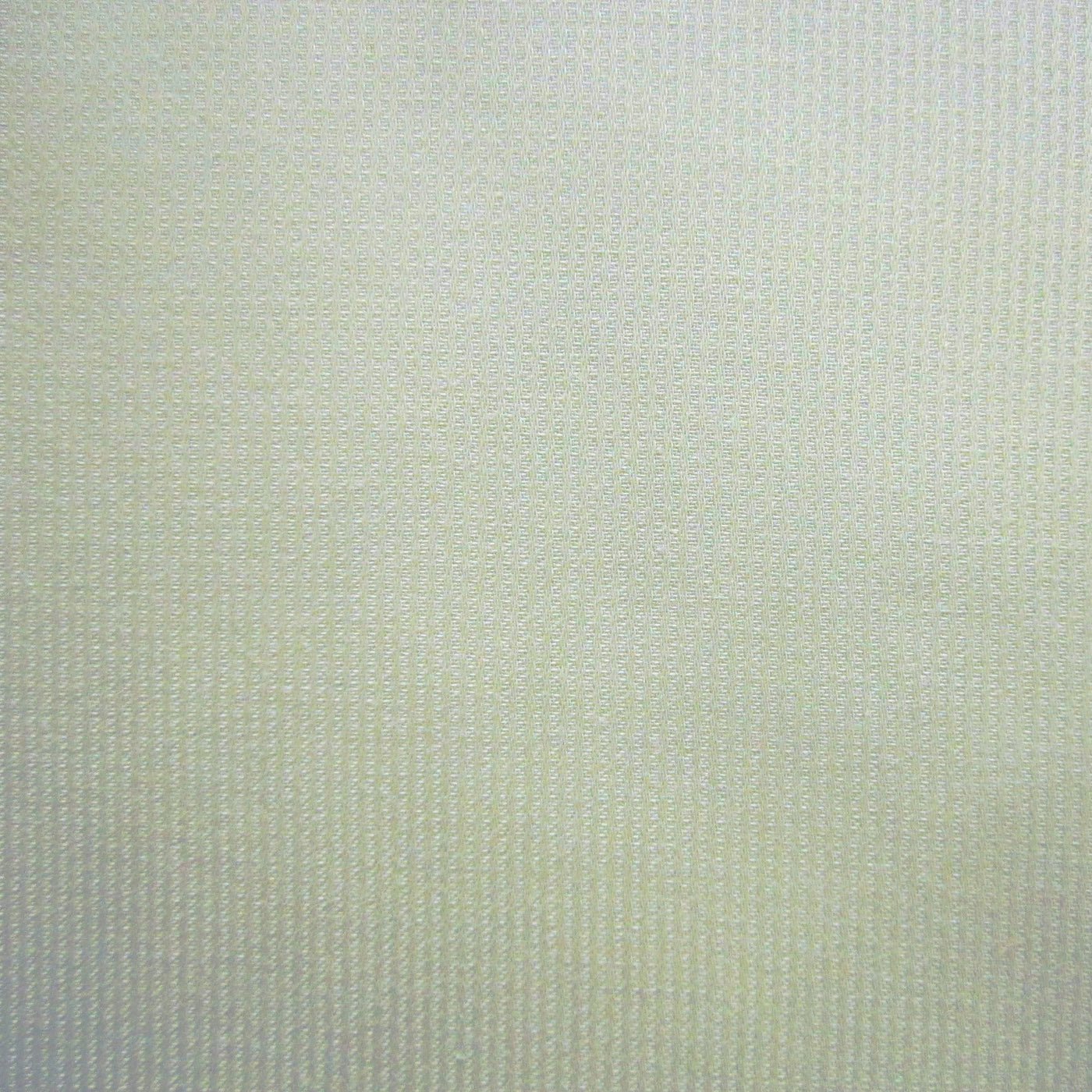 Ivory cotton fabric close-up with fine ribbed weave texture.