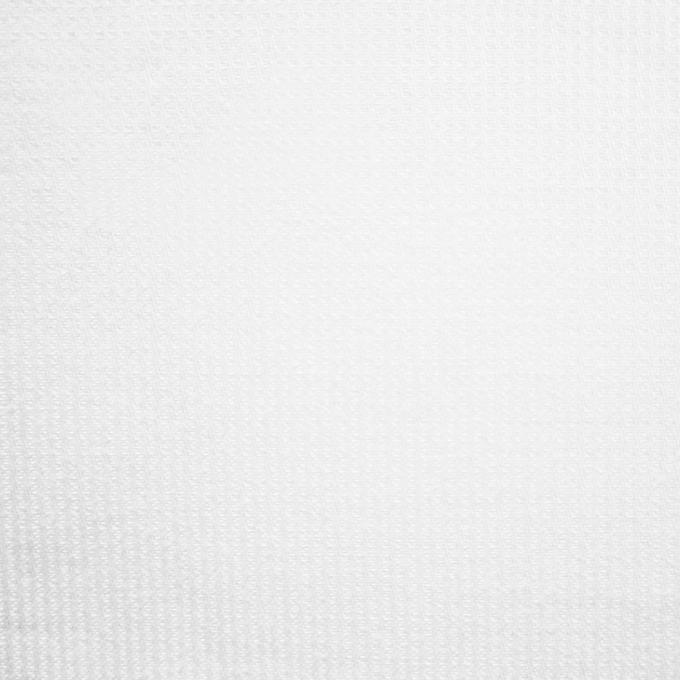 Close-up of Home Treasures Miller fabric in white with subtle woven texture.