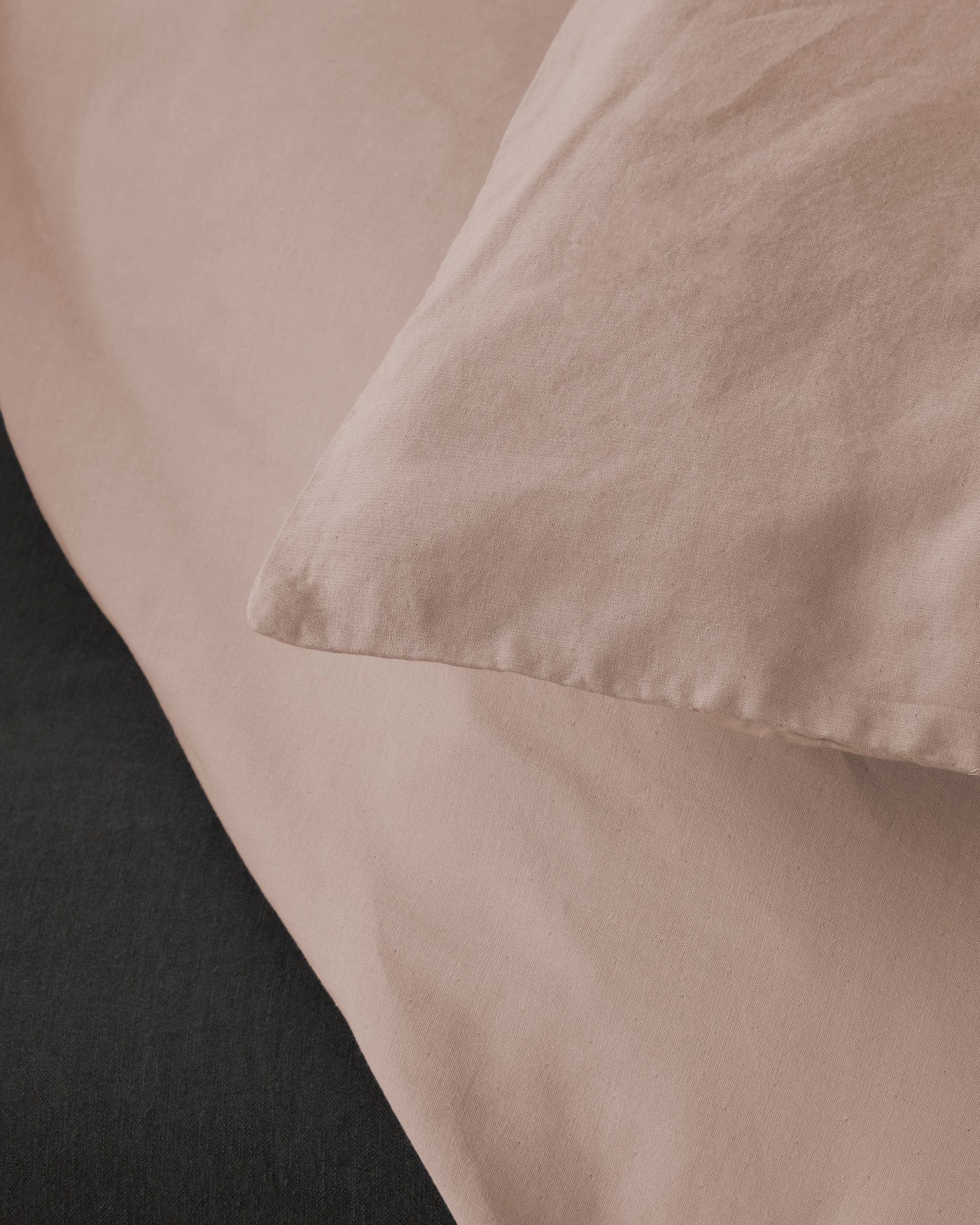 Close-up of Society Limonta Miro duvet cover corner seam in blush cotton.