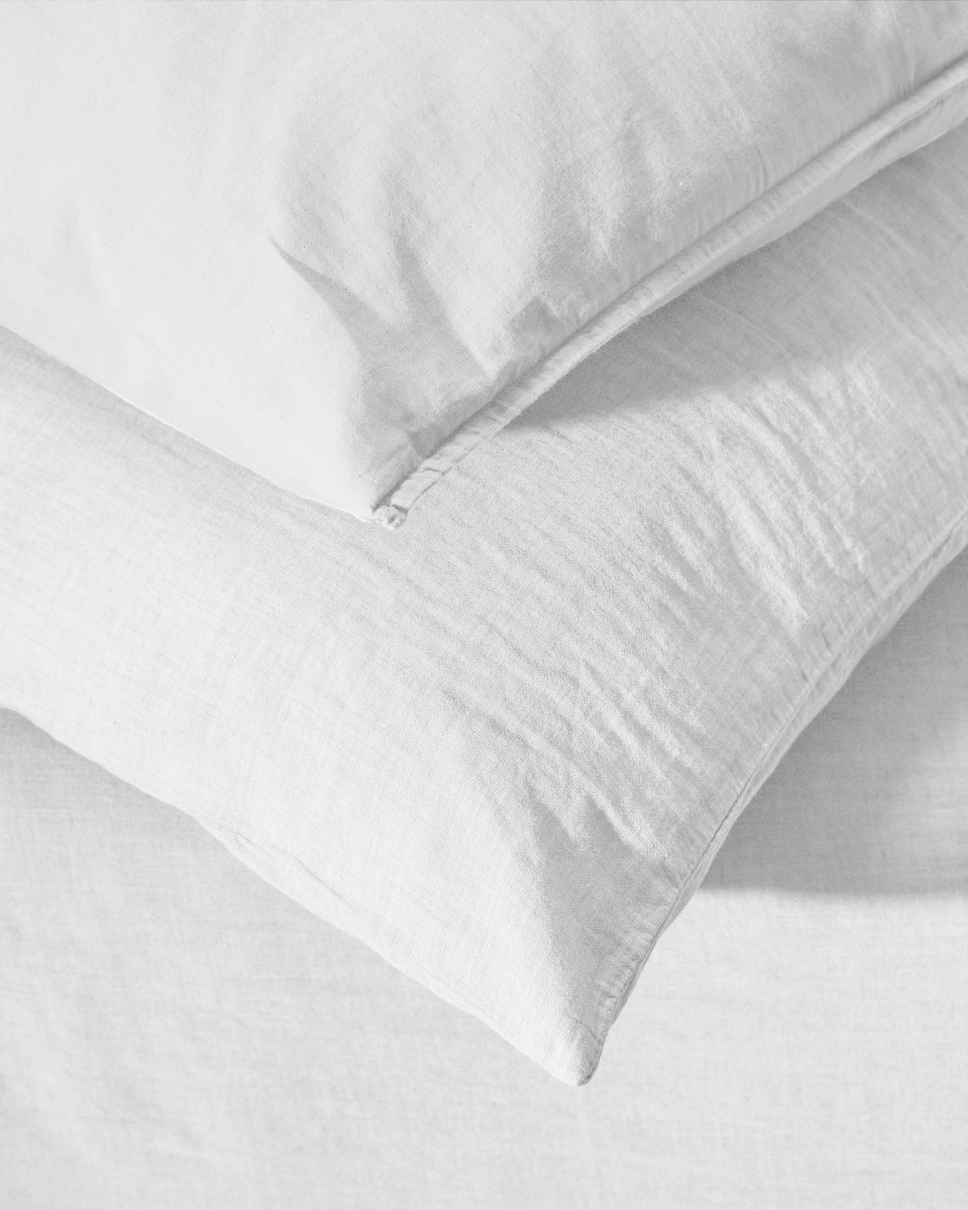 Close-up of Society Limonta Miro pillowcase zipper closure in white washed linen.