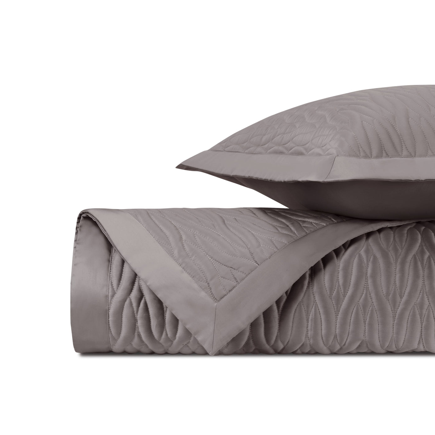 Close-up of Home Treasures Napa quilted satin in taupe with wave stitching detail.