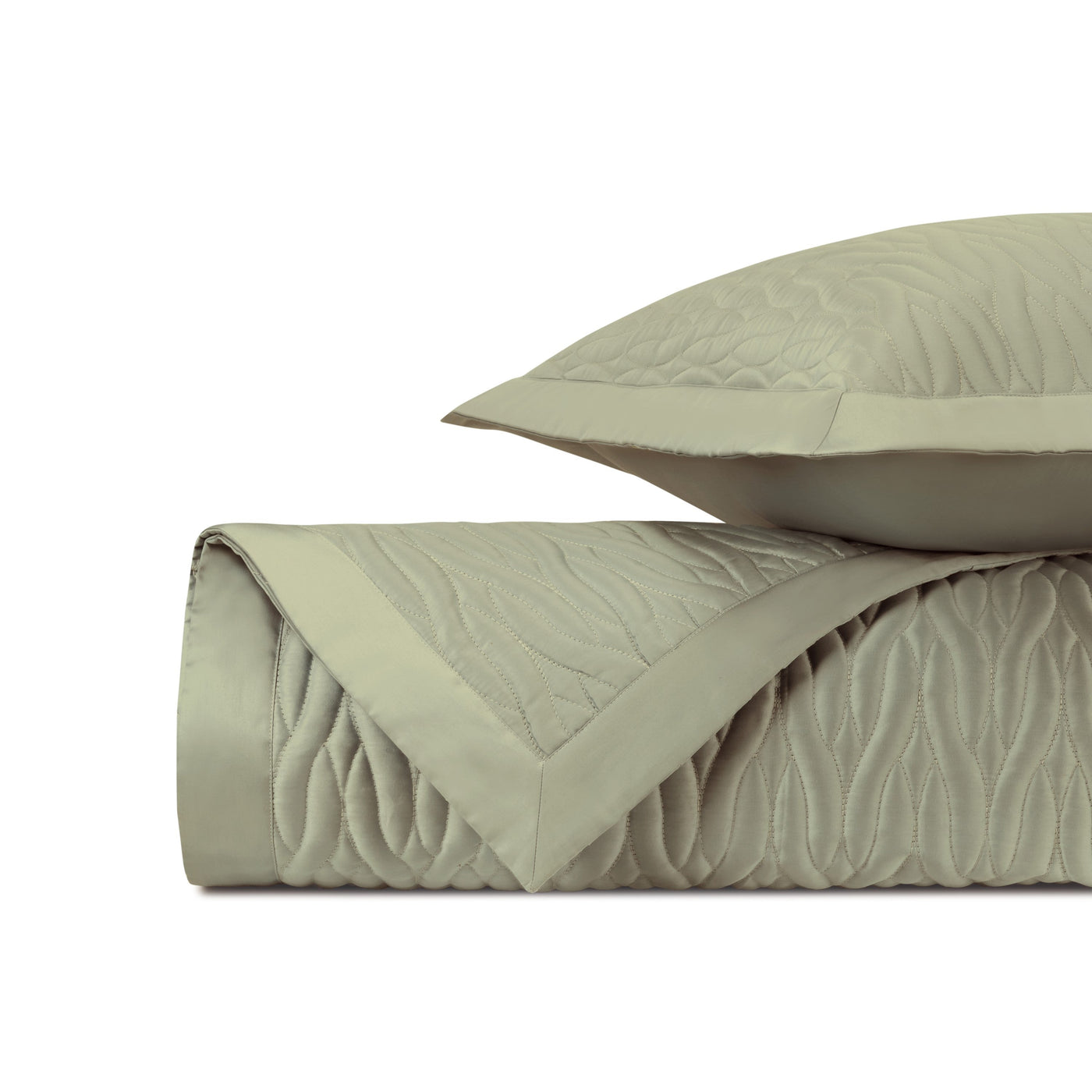 Close-up of Napa quilted texture in sage with wave-pattern stitching and sateen border.