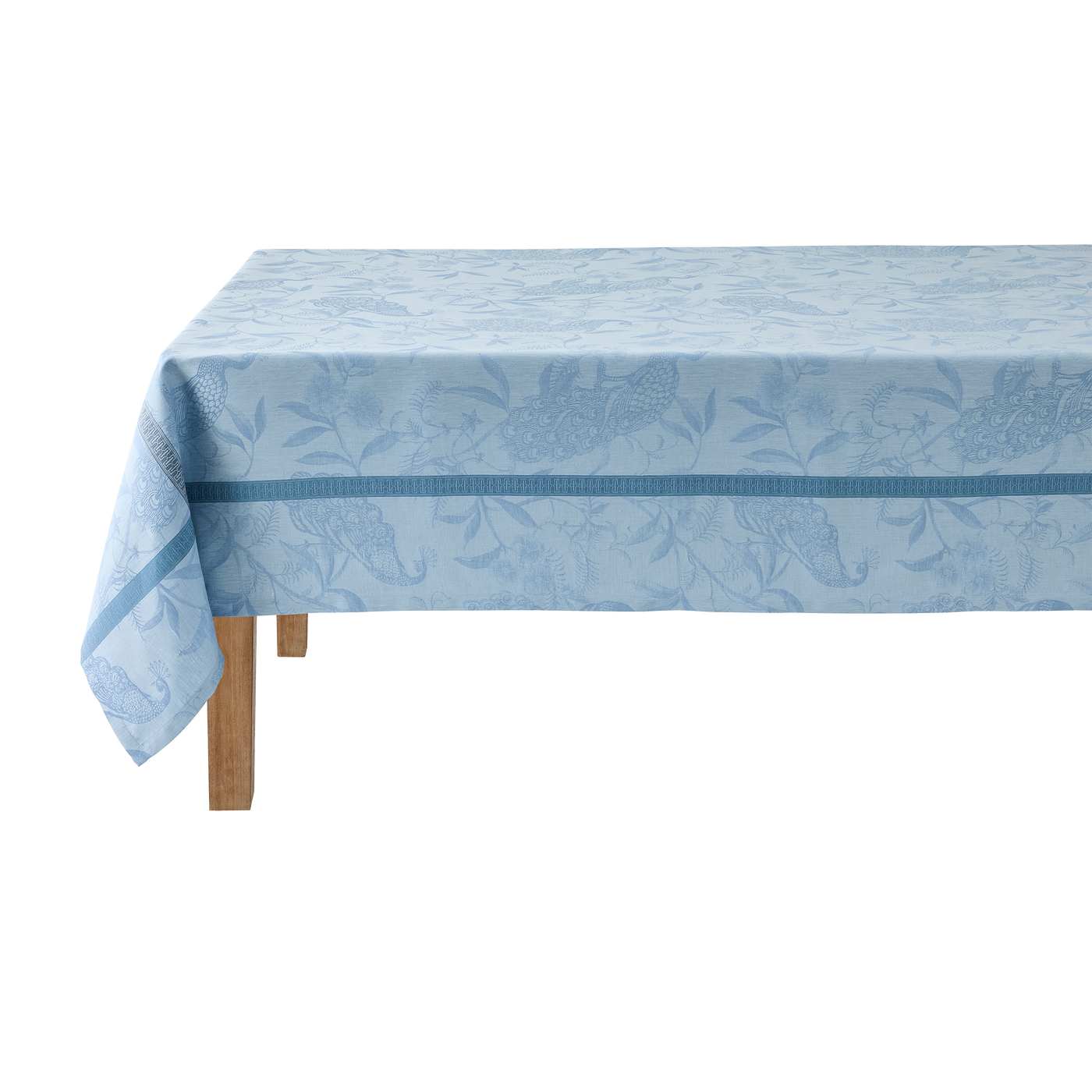 Close-up of tonal cerulean jacquard weave with botanical motif and contrast border trim.