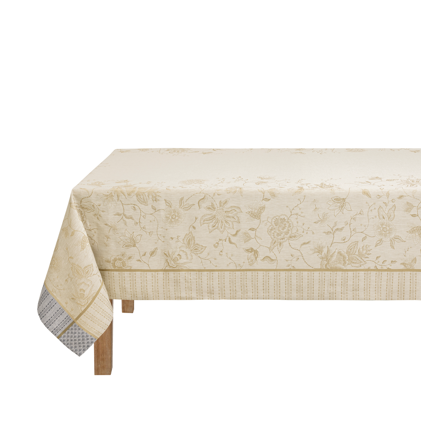 Ivory and gold floral jacquard tablecloth draped over a wooden table, angled view.