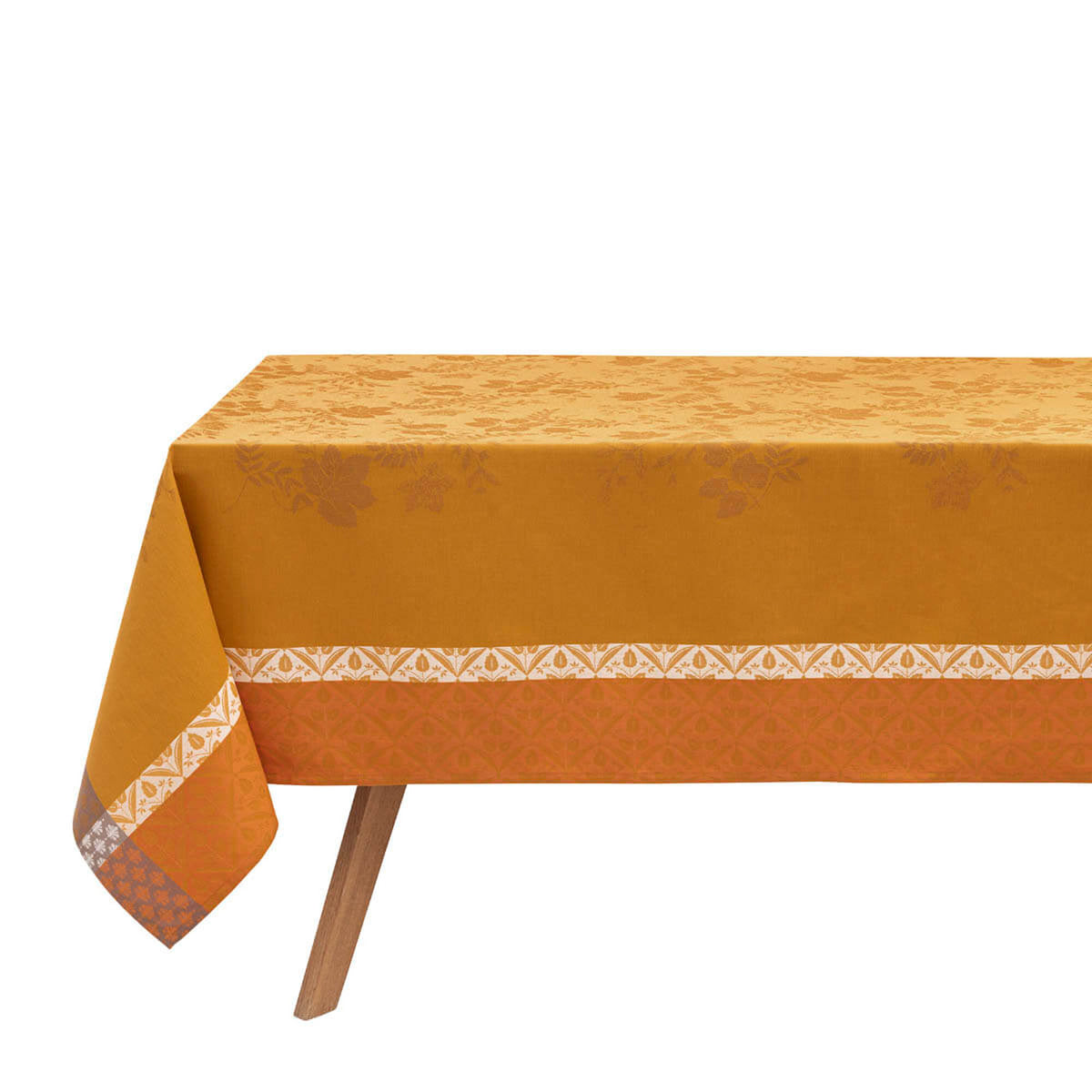 Le Jacquard Français Manor Lane tablecloth in Orange, showing full drape with woven border detail.