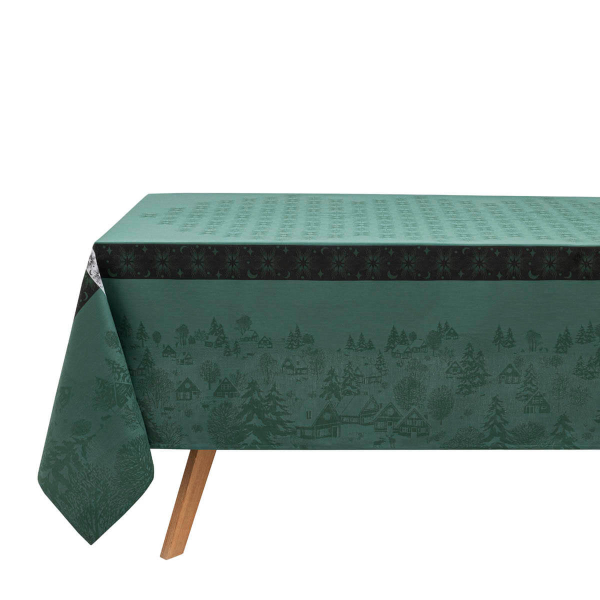 Le Jacquard Français Sous les Étoiles tablecloth in Green, woven winter village scene.