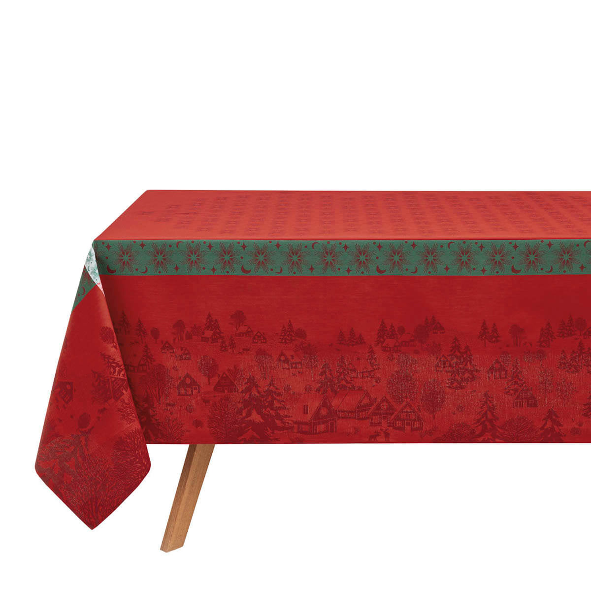 Le Jacquard Français Sous les Étoiles tablecloth in Red, draped on table, green border with snowflake trim.
