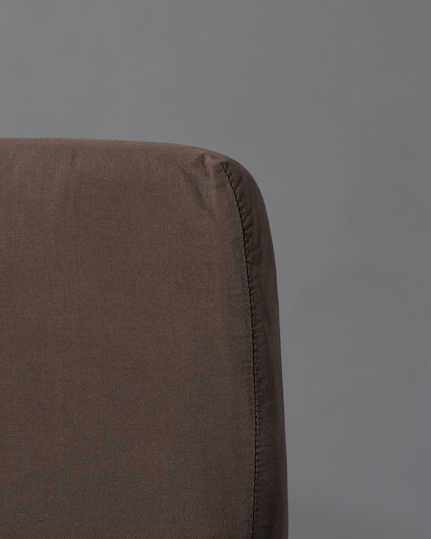 Close-up of Society Limonta Nite fitted sheet corner seam in espresso linen.
