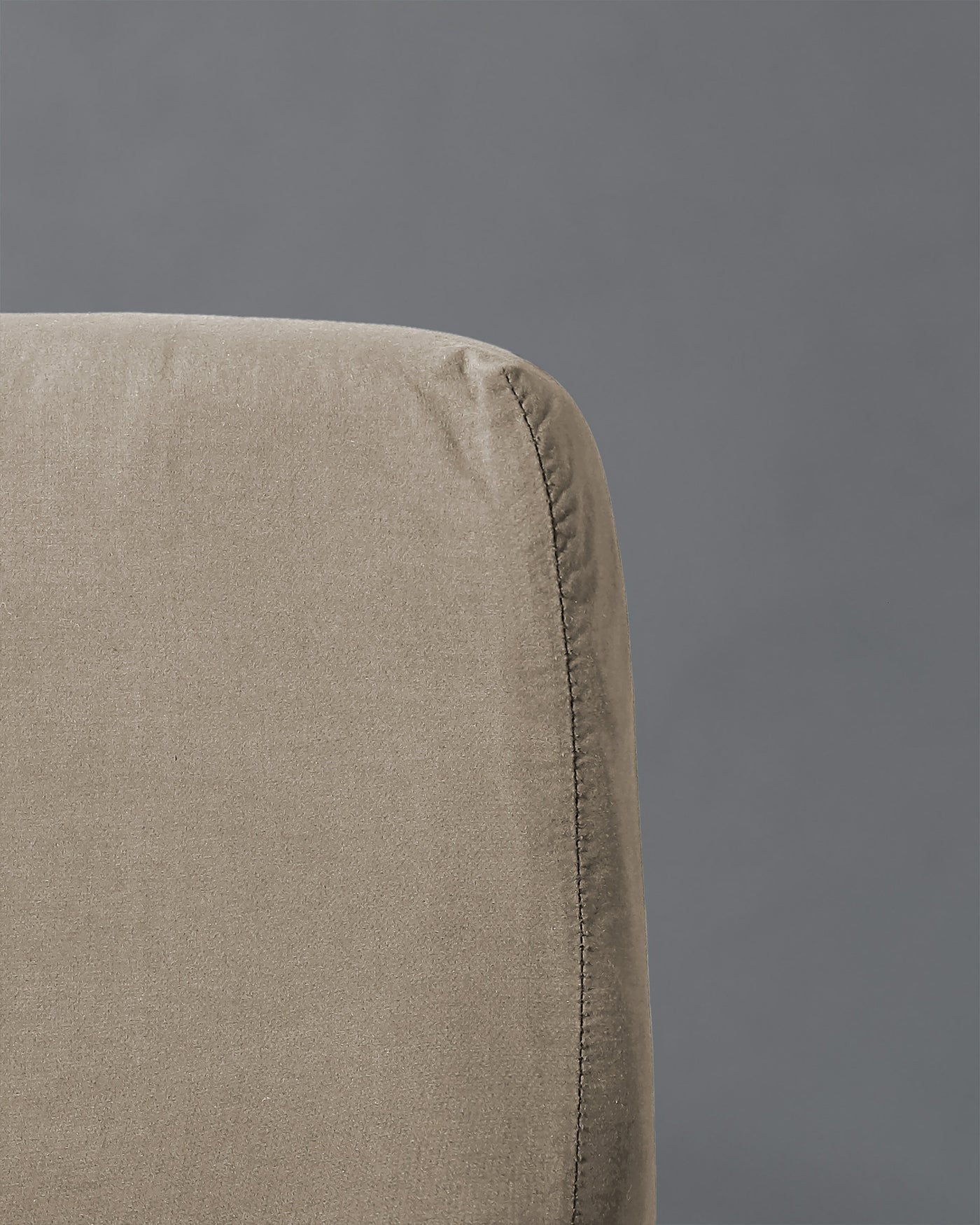 Close-up of Society Limonta Nite fitted sheet corner seam in sand linen.