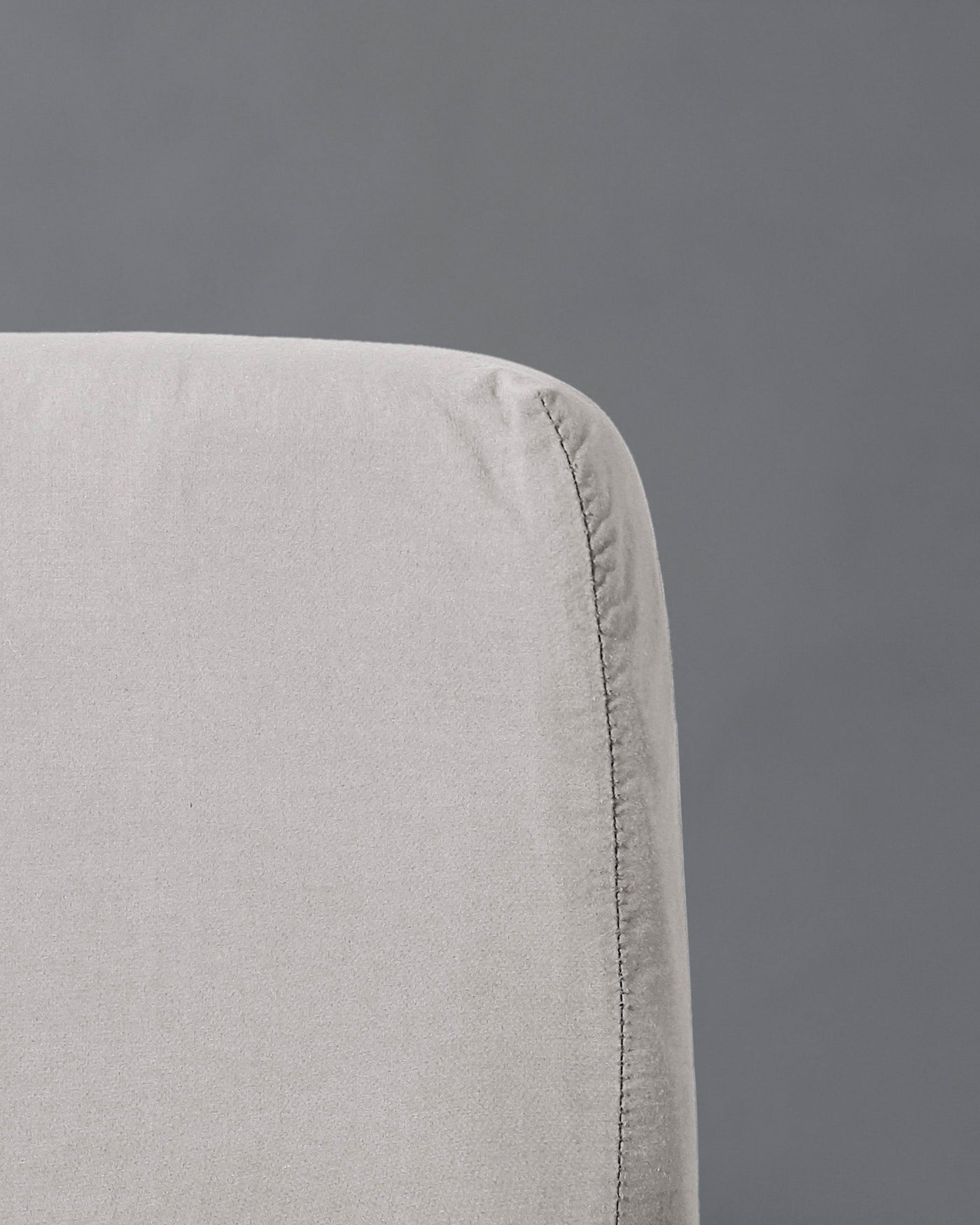 Close-up of Society Limonta Nite fitted sheet corner seam in silver-grey linen.