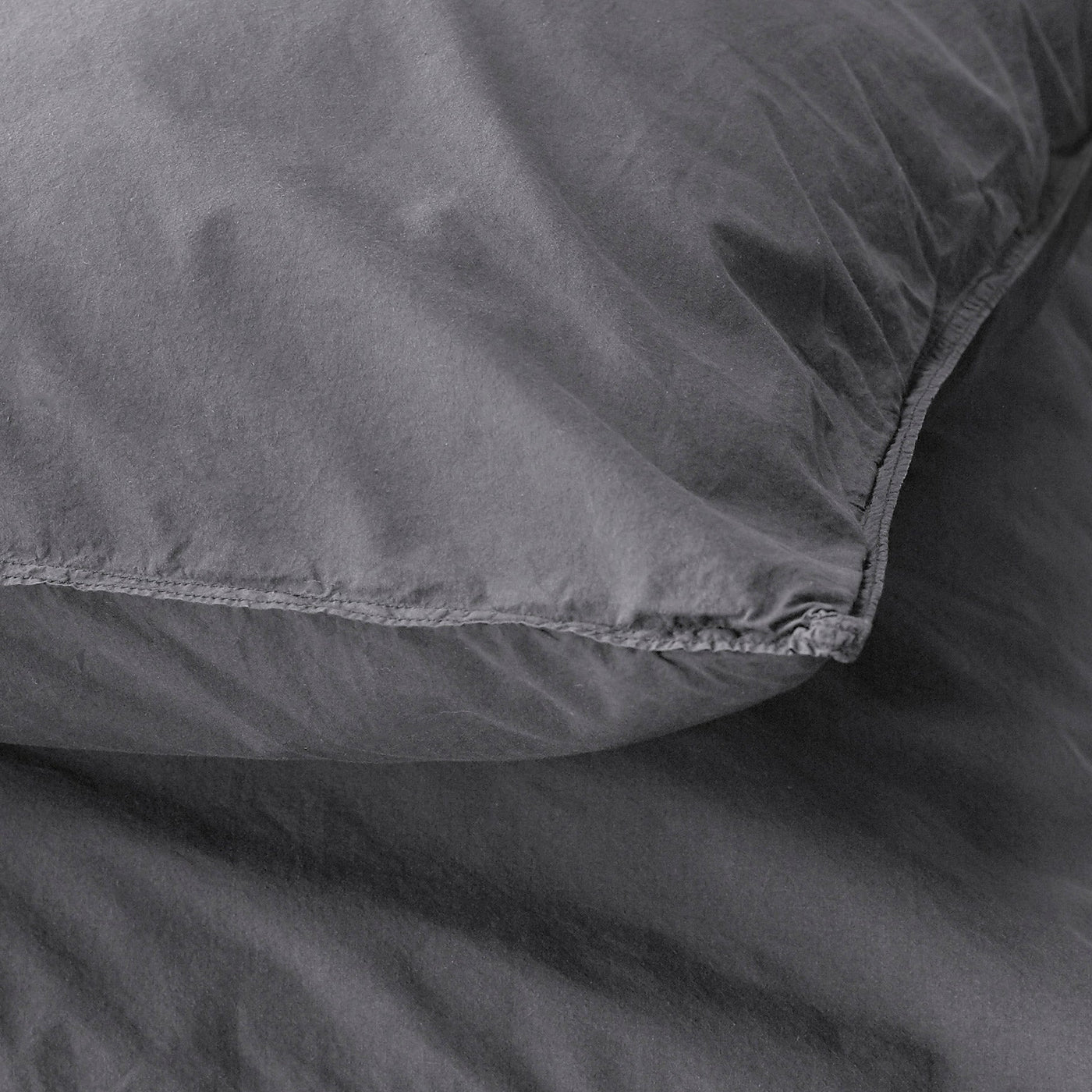 Close-up of Society Limonta Nite pillowcase edge stitching in slate washed cotton.