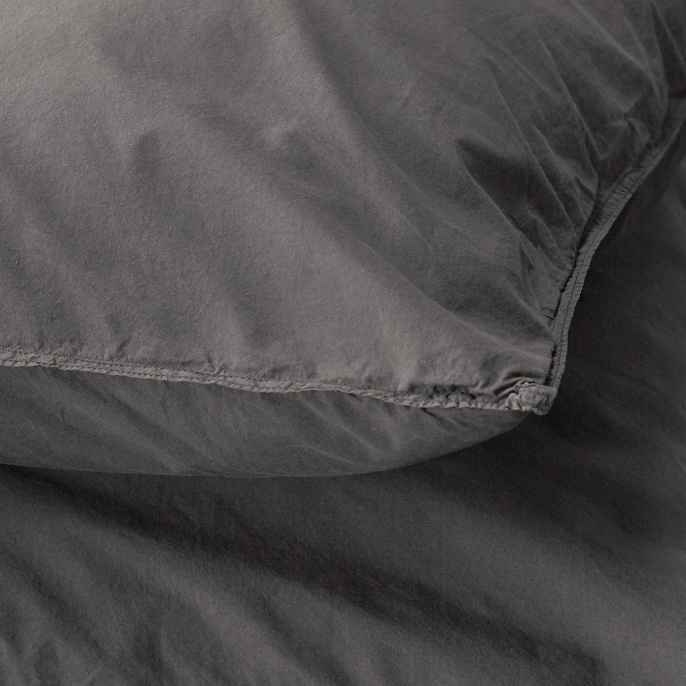 Close-up of Society Limonta Nite pillowcase seam detail in charcoal washed cotton.