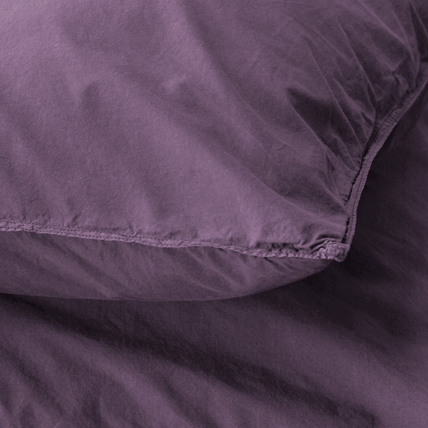 Close-up of Society Limonta Nite pillowcase seam detail in deep plum washed cotton.