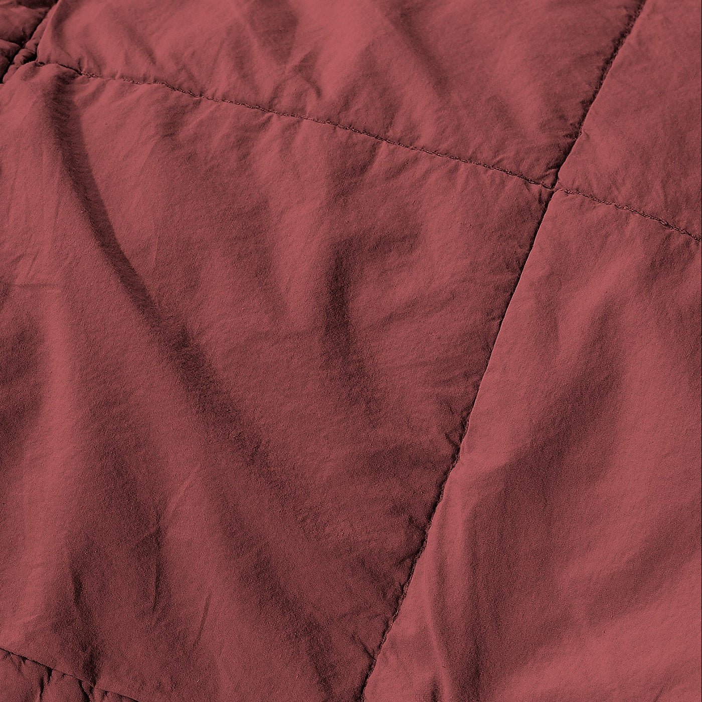 Close-up of Society Limonta Nite quilt stitching detail in deep burgundy washed linen.