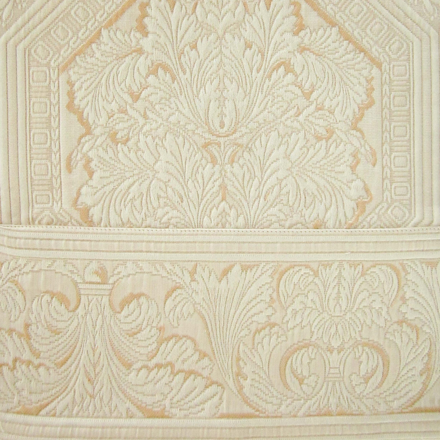 Close-up of ivory and champagne jacquard damask weave on Olympia pillow sham border detail.